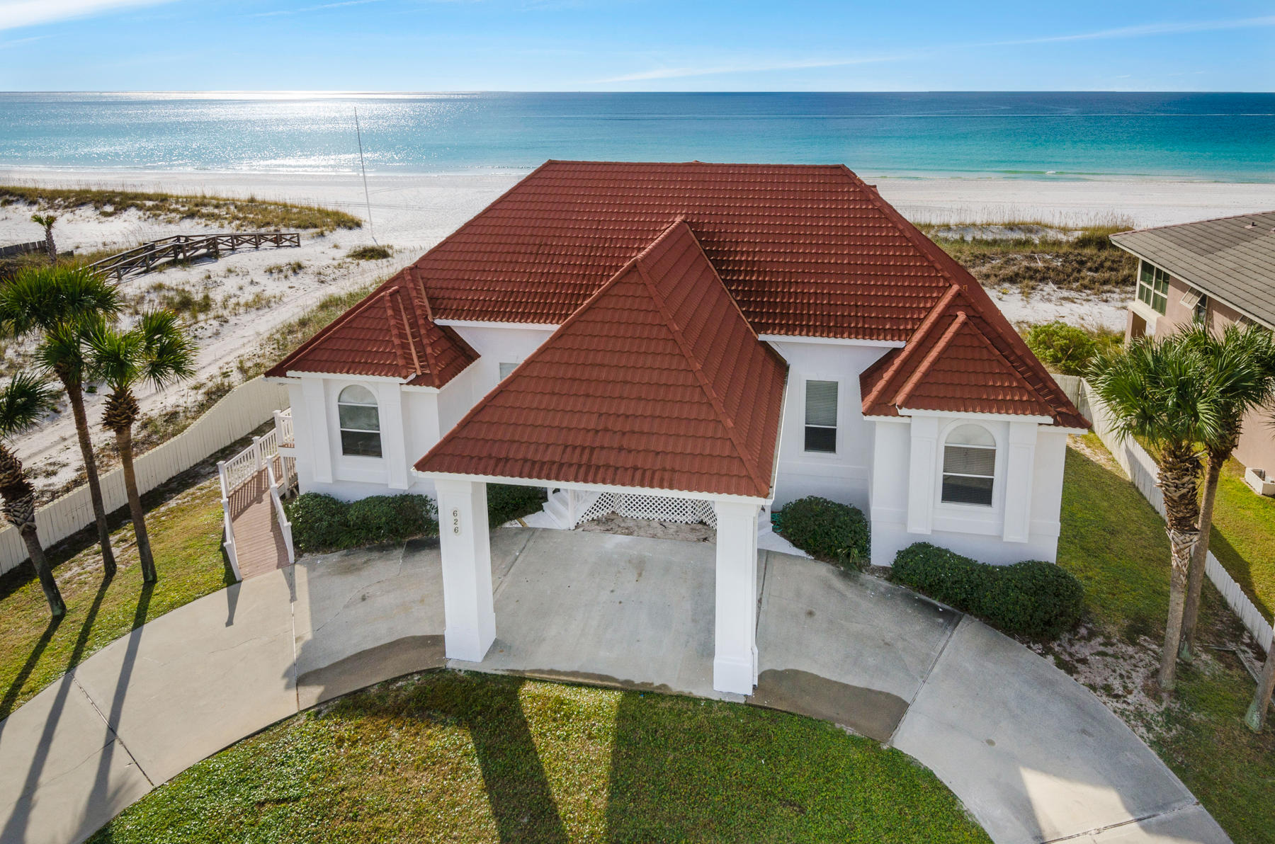 Rare one acre Gulf-front retreat with 100ft of beach frontage and a private beachfront pool on Holiday Isle's pristine shores.''Holiday Blitz' is one of only a few gulf front homes with a footprint this large and 100 feet of shoreline. ACTUAL rental income exceeded $238K in 2019, and over $220K for the previous two years. Updates in 2015 included Luxury wide plank vinyl flooring, natural stone counter top's, kitchen cabinets, interior/exterior paint, and the addition of the pool. With room to gather, functional design elements, and coastal details, this 7 bedroom home with an additional bunk room is designed for groups of family and friends to enjoy a stay at the beach. Two stories of balconies extend the width of the home and overlook the dunes.