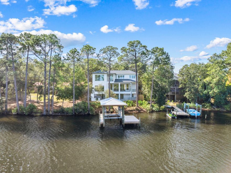 NEW HOME ON LAKE POWELL IN INLET BEACH WITH WATER, WATER, WATER VIEWS EVERYWHERE!Experience extraordinary lakefront living in this stunning 4,432-square-foot, 5 bedroom, 5 bath residence on Lake Powell. Designed with both comfort and entertainment in mind, this home offers a lifestyle unlike any other--where boating to the beach and upscale dining on the east end of the famous highway 30A are all part of your everyday experience.The main level welcomes you with an open-concept living, kitchen, and dining area with a master suite, ideal for entertaining while taking in the lake views from the expansive balcony.  Downstairs the Lake/Pool level offers a bunk room,  a game room, media room and full bath, perfect for gatherings after a perfect day of boating to the beach Hardwood and shell stone floors flow seamlessly throughout, adding warmth and elegance to every space.  The third floor features an additional master suite, 2 additional bedrooms and 2 bathrooms, each offering serene vistas of the lake and surrounding lush vegetation. 

Outdoor living is at its finest here. A sparkling private pool, complete with an outdoor kitchen, creates the perfect backdrop for entertaining or relaxing under the Florida sun. From your private dock complete with boat lift,  you can launch straight into boating adventures on Lake Powellthe largest coastal dune lake in North America.

Located just moments from 30A Avenue, you'll enjoy effortless access to world-class dining at favorites like Amigos and Amici 30A, Cuvee 30A, and Aja Kitchen, along with boutique shopping and local hot spots. The new pedestrian underpass makes reaching the white sandy beaches of the Gulf of Mexico and the charm of Rosemary Beach both easy and convenient.

This home is more than just a residenceit's a lifestyle. A rare opportunity to enjoy the very best of both beach and lake living awaits.

