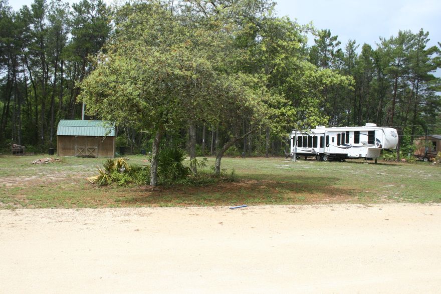 Located less than a half mile from the gorgeous blue waters of the Gulf of Mexico, in the transitioning area of Inlet Beach is this fantastic homesite, walking distance to many new shops and restaurants. Situated along a quiet cul-de-sac, this property is one of only 7, and already has some utilities available. Included with the property is a 39 foot 5th Wheel camper, 1 bedroom, /1 bath, sleeps 4+. This property is perfect for the weekend getaway, or place to stay while building your dream home close to the beach.