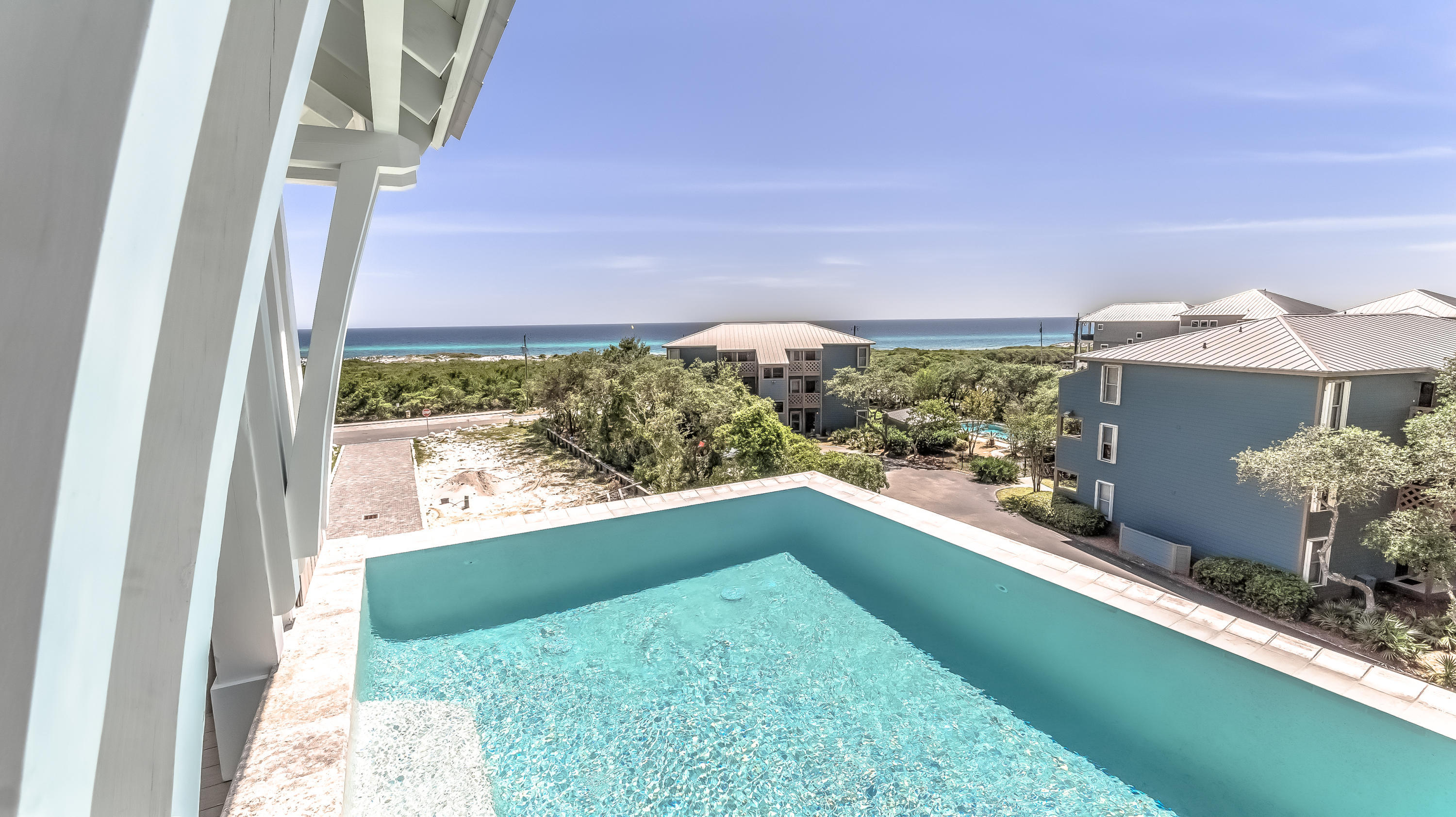 Spectacular new-construction home with breathtaking forever views of the Gulf of Mexico.This home is the 1st of 7 total that will make up Mala Beach, one of Inlet Beach's newest premier gulf-side neighborhoods.Situated just steps from Walton County's largest beach access, you can walk out your front door and have your toes in the sand in less than 3 minutes.Enter the home through the front door and you're met with dramatic 14-ft ceilings and beautiful shiplap covered walls. The downstairs consists of 2 bedrooms, one that's been purposed as a bunk room with unique loft-style beds for the kids, and the other a downstairs master suite with attached full bath.Luxurious finishes including a wet bar with built-in wine cooler and an elevator that services all 3 levels. See Mo