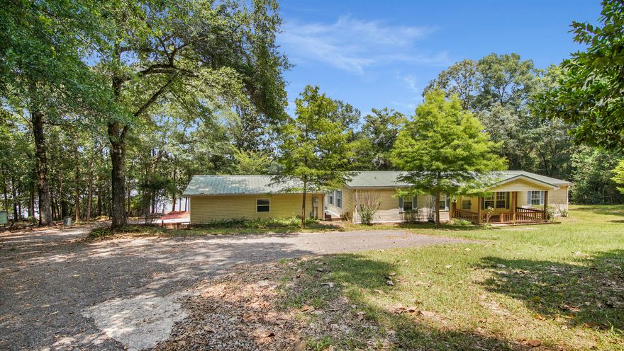 NEED SPACE?  WANT WATERFRONT? LOVE TO FISH?  then don't miss this opportunity to live on King Lake one of NW Florida's premier bass lakes.  3 bedrooms, 2 bath manufactured home with a detached garage on 2.5 wooded acres.  the Florida room overlooks the lake. The master bedroom has an adjoining office, perfect for someone who works from home.   Easy access to the beaches of south Walton County.   Price right.  Easy to show.