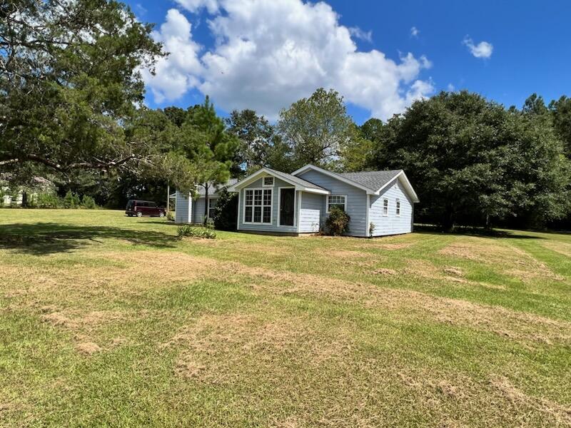 BRAND NEW ROOF AND FLOOR!! NEW PICTURES COMING SOON! Check out this large 3 bedroom, 2 bath home, almost 2000 sq feet., with a large bonus area that can be used for 4th bedroom plus play area, office, den, etc. The home is situated on 1.27 acre, nice country setting. The home has a brand new AC unit less than a month old, new water pump, almost all electrical is new and updated. The septic and well is older but very functional and has been inspected. This home is conveniently located just 20 minutes to Crestview or DeFuniak Springs and just a short drive to a school.