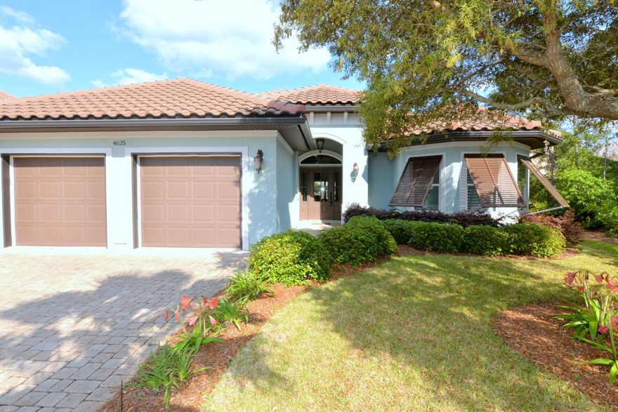 THE PERFECT PACKAGE  Gorgeous five-year-old custom-built one level home & great location...in a gated community across from the beach! This house has all of the bells & whistles  it's all in the details! The open floor plan features a knock-out kitchen flowing seamlessly into the dining area, living area & opening fully through numerous sliding glass doors to a cozy screened porch with a fireplace for chilly nights. The kitchen showcases lovely granite, stainless steel appliances including a gas Bosch oven & cooktop, tile backsplash, breakfast bar with pendant lights, custom cabinets, & a walk-in pantry. This is a wonderful home with many amenities some of which are: hardwood floors; elaborate molding & ceilings; the latest code windows, doors, & tile roof; tankless hot water heater,