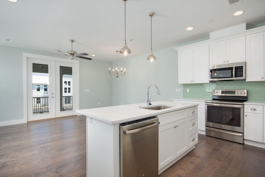 A rare find in South Walton, 30A Townhomes features new construction luxury townhomes with single car garages located directly on Scenic Highway 30A in popular Seagrove Beach. The Sandpiper Plan is a spacious two-story residence with over 1,500 square feet, three bedrooms and two bathrooms. An open-concept reverse design provides added privacy to the first-story master suite featuring a private patio. The second story includes a fully equipped kitchen with an island, a spacious living and dining area with a generous 19'x10' covered porch and two guest rooms with a shared bathroom. Upscale included features are found throughout such as designer lighting, hardwood floors, granite countertops, shaker wood cabinetry, crown molding