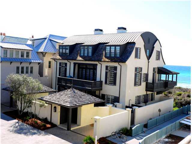 Striking Gulf front home in Rosemary Beach designed by architect Bobby McAlpine, that boasts both beauty and functionality. This 3 level Dutch Colonial custom built home offers over 5,000 square feet of sophistication and is positioned on a double estate size lot. Featured in Coastal Living magazine in October 2010, interior designer Susan Ferrier showcased the large open spaces with a relaxed, calming vibe using light and airy sky blues, creamy whites, sandy taupes, and driftwood grays tempered with an occasional shot of earthy brown. The Interior was designed to accentuate the 18 foot ceilings, spacious master suite, downstairs den, the large family dining area, beamed ceilings, and phenomenal gulf views as far as the eye can see. Practical, yet refined kitchen is a chef's delight