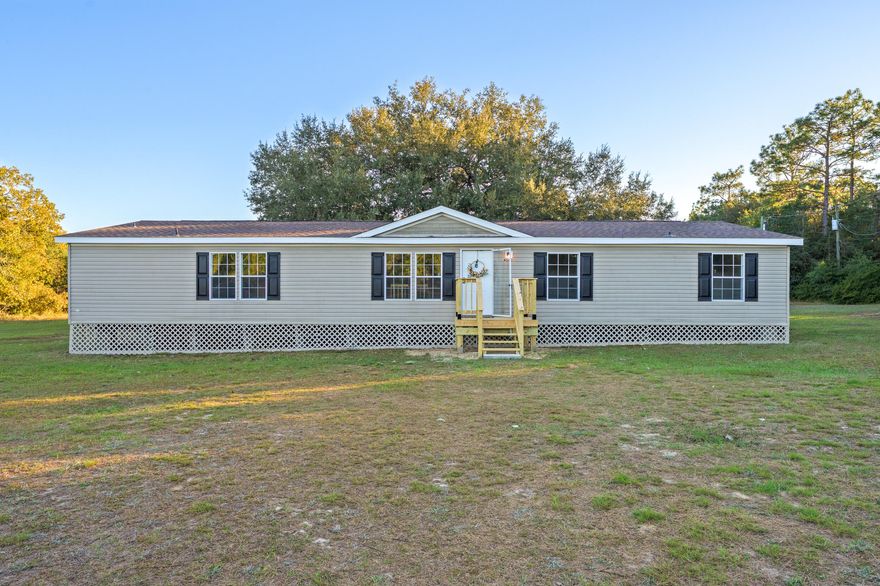 Welcome Home! This beautifully renovated 5-bedroom, 3-bathroom mobile home, updated in 2025, offers 2,108 sq ft of living space on a generous 1.01-acre lot. Featuring a brand-new roof, all-new stainless-steel appliances, a stylish tile backsplash, and fresh cabinets with modern hardware, this home is designed for comfort and style. Enjoy the durability of LVP flooring throughout, new light fixtures, and upgraded insulation. Relax on one of the three newly added porches--front, side, and back--while taking in the evening views. The washer and dryer will convey in AS-IS condition. Additional updates include stunning quartz countertops and new skirting, among many others. Conveniently located on the north end of Crestview, w/ easy access to local shopping. Call today to schedule a tour!