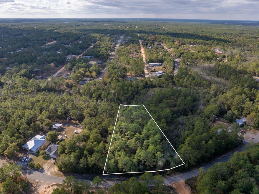 Discover the perfect opportunity to build in beautiful DeFuniak Springs! This serene 1.03-acre wooded triple lot offers endless potential--whether you're looking to build, place a new tiny home, or invest and hold longterm.With no HOA, you have the freedom to create exactly what you envision: a dream home, a workshop, a mini farm retreat, or even develop three separate properties, one on each lot. Enjoy the privacy and beauty of nature!Power and community water are available at the street (water & electric tap fees not paid). Lot dimensions are approximate--buyer to verify all boundaries, utilities, & intended use.  Come walk the property and explore its potential firsthand. Paved road. No flood insurance required.