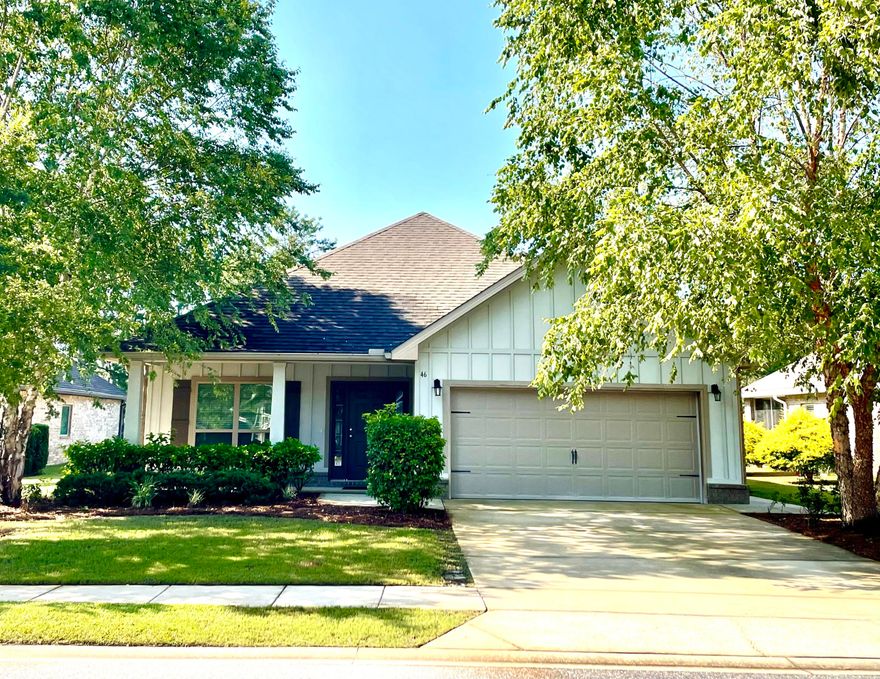 Beautiful craftsman style home with the popular Bailey Floorplan situated on a quiet cul de sac within Passages of Hammock Bay and overlooking Lake Hemingway. Original owners' upgrades make this a special home; arched thresholds, crown molding, trey ceilings, hardwood flooring, granite countertops, recessed lighting, wood cabinets, natural gas convection stove/oven, tumbled stone backsplash, 2'' blinds throughout and much more. Master bedroom features a large walk in closet and en suite bath with a garden tub, a separate walk-in shower and double vanity with beautiful granite countertop. Two guest bedrooms each have walk-in closets providing plenty of extra storage. Beautiful landscaped backyard can be enjoyed from your screened in porch out back and enjoy the wildlife on the Lake.