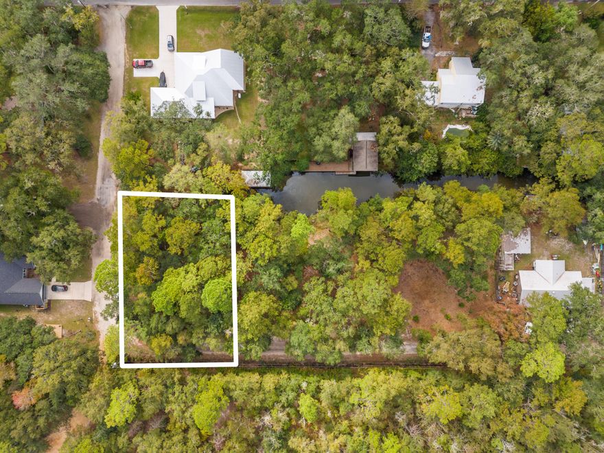 Great Waterfront lot with no HOA on canal with access to the Choctawhatchee Bay. Build to suit your home complete with privacy and peacefulness at your fingertips. Public water and sewer taps available through Freeport City Utilities. Land is in Flood zone X, high and dry. Sellers have had a pontoon in the canal, specific depths are not known.  2 Adjacent lots available, see pictures.  Sellers are willing to join and sell together. See MLS # 962231 and 962233