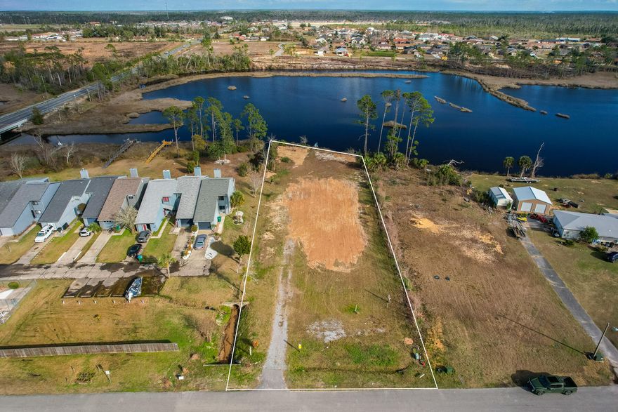 Beautiful waterfront vacant land expanding 107' in total. This property is only 7 miles from Tyndall Air Force Base, 26 miles to Northwest Florida Beaches International Airport (ECP), and a short & sweet 16 miles to the worlds most beautiful beaches. This location has already been pre-engineered and pre-approved by the City of Callaway Development Order for a 12,200 square foot six condo project, or three townhomes. Taken out by Hurricane Michael, previously there did sit a home that was 3500 square feet, however there is more than enough room to build a home up to 5000-6000 square feet, including a pool.

Water, sewer and power on site.