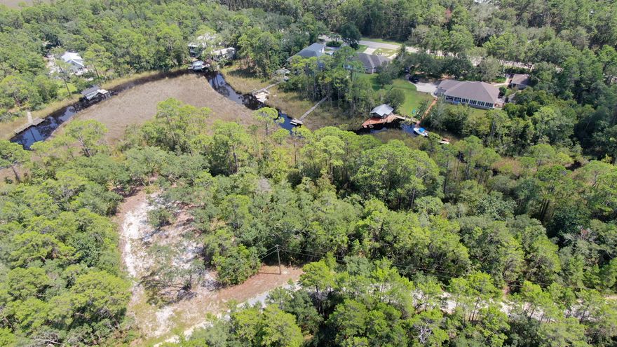 Lot 1 Dog Hobble Lane is nestled in a true ''Old Florida'' location. This lot enjoys waterfront access to Tucker Bayou that feeds into Choctawhatchee Bay and the Intracoastal Waterway. Just down the road is a county maintained boat launch and Eden Gardens State Park. Travel south on 395 and find yourself in the heart of Seagrove Beach and enjoy everything 30A has to offer.