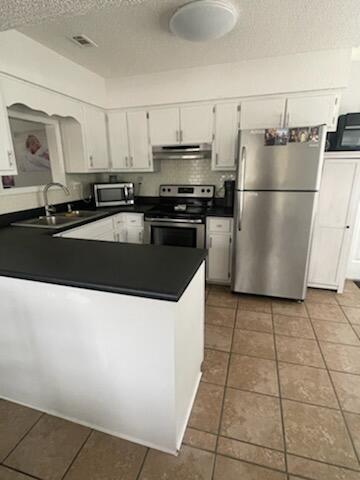 Newly remodeled home in South Crestview on a large corner lot!  This beautiful home has new paint, backsplash , new vanities, light fixtures and newer stainless-steel appliances .  The roof was replaced in 2016 and the AC was replaced in 2018! Out back there is a screened in back porch ,  a storage shed, and a large shed/shop with electricity ran to it,a large back deck , and it is all inside of the gated back yard.  Professional pictures coming soon! Open house this weekend 3/25-3/27