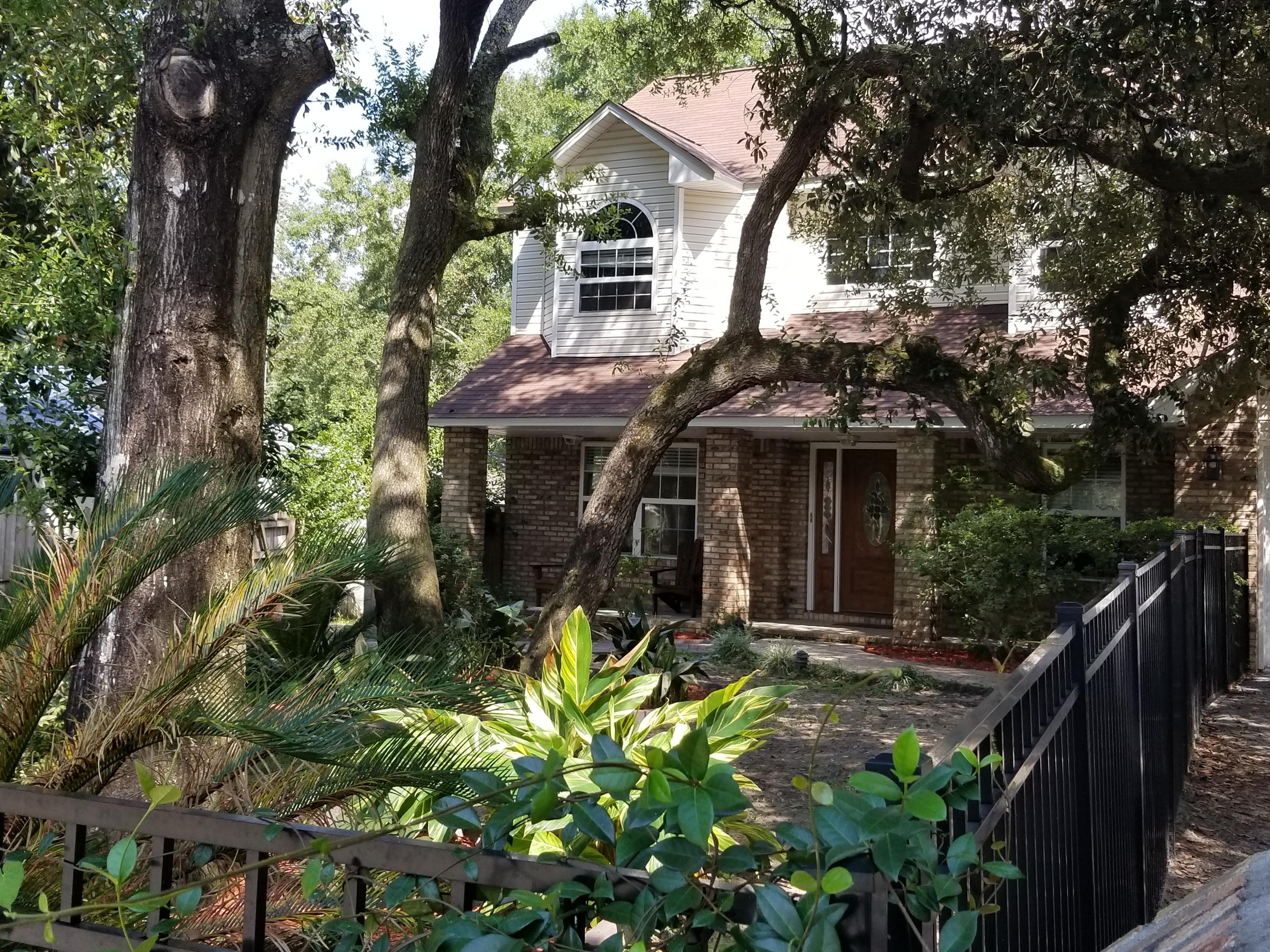 WATERFRONT Home-MOTIVATED SELLERS- CONVENIENTLY Located! Nested on a quiet street. Gorgeous Southern Charm front courtyard entrance, beautiful mature trees, Koi pond, back with relaxing decks, fishing dock, boat house, shed, fenced yard. All just minutes away from Beaches, Hwy 98, Publix's, I-10 and Niceville. Open Floor Plan with Family Room & Kitchen, Two Living areas with Barn Door allowing Formal Living & Dining diversity. Wood Burning Fireplace,Spacious Laundry Room,Tile Floors, Wood Tread Stairs, Carpet in Bedrooms. Ideal for family or entertaining. Plenty of Parking space. CALL TODAY!