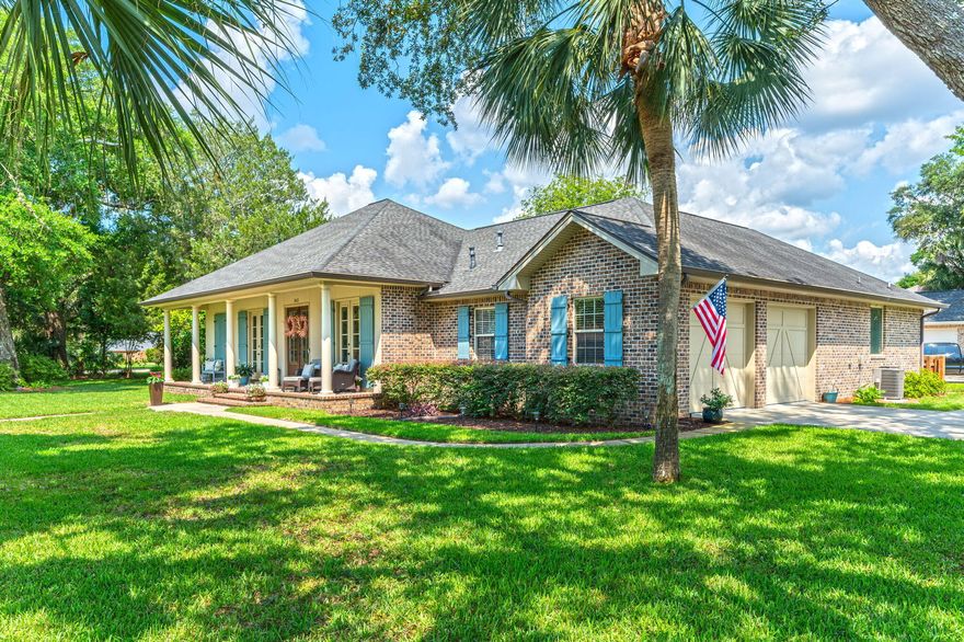 Welcome to a rare opportunity in one of Fort Walton Beach's most sought after neighborhoods--Elliott Point. Perfectly positioned on a prominent corner lot on one of the best streets in town, this beautifully maintained 4-bedroom, 3-bath residence offers the best of coastal living--with multiple water access points just steps away.Enjoy water views of the Intracoastal Waterway from your front porch and direct access to it across the street. A private, deeded community dock--shared by only five homes--invites you to paddleboard, fish, enjoy the fireworks or take in the sunset. Residents also enjoy access to a neighborhood boat ramp and a sandy beach area--ideal for swimming or launching watercraft.Built in 2014 by Walton Properties, this 2,569 sq ft home combines timeless Southern charm with modern convenience. Inside, you'll find soaring ceilings, crown molding, and an airy, open floor plan. The living room centers around a cozy gas fireplace and flows to a large covered back porchperfect for morning coffee, grilling or evening cocktails. The backyard is designed for relaxed entertaining, complete with a custom wood pergola with power & ready for you to add a jacuzzi if you wish, a pavered patio, a built-in fire pit, and a powered workshop. 

The newly remodeled kitchen is a coastal showpiece, featuring blue vein quartz countertops, a matching backsplash, a custom built-in range hood, and a large island with breakfast bar. A gas stove, oversized refrigerator/freezer, and walk-in pantry offer both style and function. Dine casually in the breakfast nook or host gatherings in the formal dining room.

The triple split-bedroom layout provides privacy for all. The serene primary suite boasts dual walk-in closets and a spa-like bath with a freestanding tub, walk-in shower, and double vanities. Three additional bedrooms (two with walk-in closets) and two full baths offer ample space for family or guests.

Step outside to a full-length brick front porch with classic columns perfect for watching neighborhood golf cart parades and waving to passersby's  along this popular walking and biking street. The oversized driveway accommodates six or more vehicles, plus a boat, golf cart, or RV. The finished oversized two-car garage features dual doors, Ninja coated concrete floors, and built-in attic storage with shelving and spray foam insulation.

An additional driveway with RV power hookup, full irrigation system with lawn pump, beautiful mature landscaping with gorgeous live oak trees and quality brick construction round out the exterior features.

Located just minutes from the charming downtown Fort Walton Beach, you'll enjoy close proximity to local favorites like restaurants, shops, parks, yoga studios, pickleball courts, breweries, bakeries, Saturday farmers markets, Friday night concerts in the park, and community festivals. And if that's not enough, you are less than 2 miles to the beautiful beaches on Okaloosa Island or a 10 minute boat ride to the famous crab island. 

This home is the complete packageimpeccably maintained, thoughtfully updated, and set in one of Fort Walton Beach's oldest most desirable waterfront communities. Don't miss your chance to own a slice of paradise.