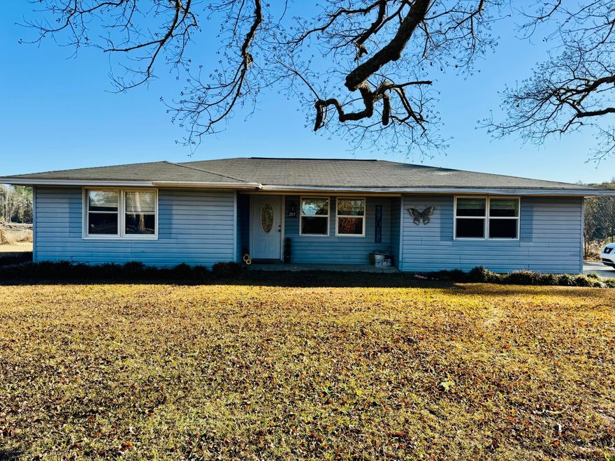 Fixer-upper on a half-acre lot with a generous outbuilding. This home offers a canvas for your vision. The 2-bedroom, 2-bath residence features a mix of tile and carpet, a tile-surround shower, and an enclosed back porch that fills with natural light. The property has been partially remodeled and is being sold as-is, with no appliances included. A standout feature is the 31 X 28 shop/barn with both an upstairs and downstairs space. Perfect for storage, a workshop, or future expansion. With plenty of outdoor space and flexible potential, this home is ideal for buyers and investors looking to customize and tailor the property to their needs.