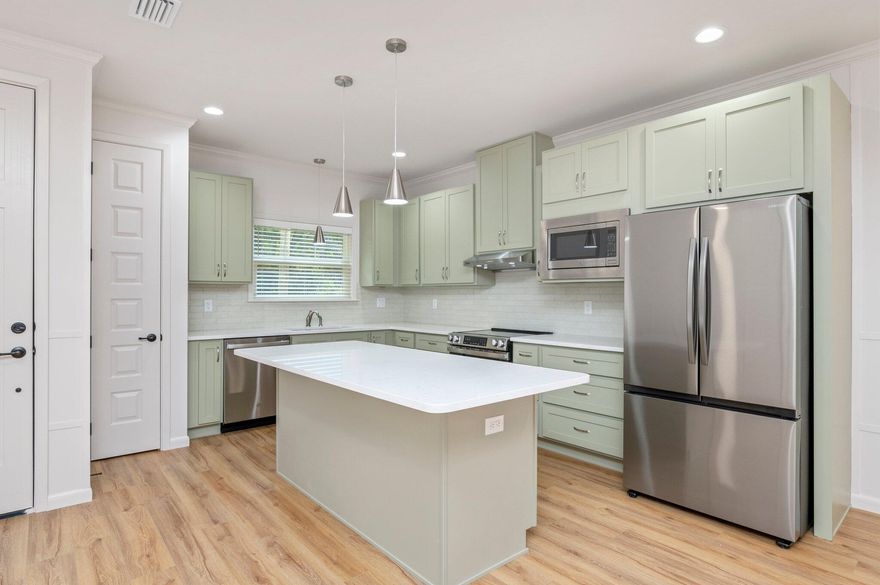 This modern property features 2 bedrooms and 2 bathrooms, perfect for those seeking a comfortable and convenient living space. The interior boasts brand new LVP flooring throughout, high ceilings, and modern fixtures, giving the home a fresh and stylish look. Say goodbye to yard work, as yard care is included with this townhome, allowing you to enjoy the outdoors without the hassle of maintenance. Further enjoyment and privacy can be found in the backyard with an 8 foot privacy fence surrounding. Don't miss out on the opportunity to make this fully updated townhome your new home sweet home.