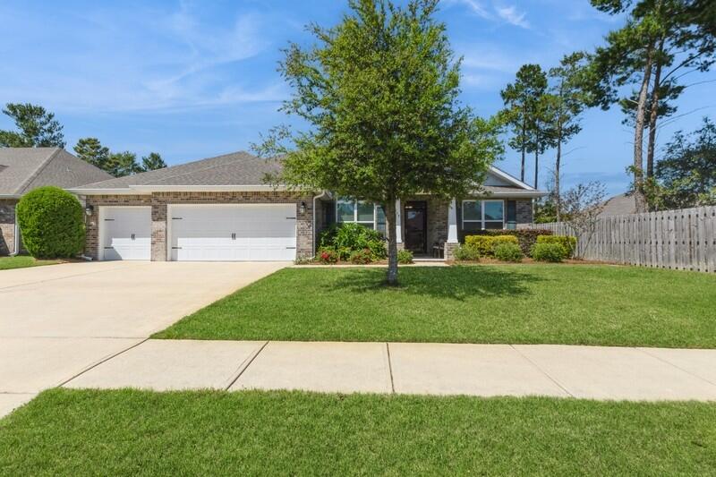Welcome to the high demand 3 car garage home in Hammock Bay totaling 2,444 square feet featuring four bedrooms and three bathrooms. The Southward facing, all brick home is situated on over an 0.28 acre lot, giving space to an expansive backyard. The openness of the popular Mulberry floor plan allows for plenty of natural light to fill the interior space while providing sectionalized living; with the first guest bedroom and en-suite bathroom located at the front of the home, and the 2 remaining bedrooms share a 'Jack and Jill' bath with double vanity at the rear. The owners bedroom offers a retreat that spans across the west side of the home for ultimate privacy. His and Her (walk-in) closet is the perfect transition from the bedroom into the spa like primary bath where owners will enjoy double vanities with plenty of counter space and storage, garden tub, separate stand up tiled shower, private water closet, and linen closet.
Hammock Bay is a premier, bayfront master planned community located just 15 minutes north of the white sand beaches of the Emerald Coast. Within the confines of the neighborhood is a 6,000 square foot clubhouse that offers residents use of the movie theatre with auditorium seating, a full caterer's kitchen to include wet bar and dining area, childs play room, and lounge overlooking the lake and pool area. Numerous on site workout and fitness facilities, competition lap pool, additional 3 Resort-style pools, pickleball courts, tennis courts, basketball court, large playground, outdoor kitchen/gas bbq areas, surround the club house and pool making it an outdoor haven for the whole family to enjoy. Sprinkled throughout the community are multiple catch and release stocked ponds, dog parks, both paved and primitive walking trails. General Store and Brewery, an additional bay front club house with fishing pier extending 500' in to the bay, an amphitheater like stage with jumbotron screen, are just a few attractions with more on the near horizon! All residents at Hammock Bay will enjoy year-round social events as well as a vibrant and active Town Center. Consider this an invitation to experience the Hammock Bay Lifestyle by contacting me today for an updated list of this months community events calendar!
