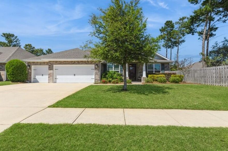 Welcome to the high demand 3 car garage home in Hammock Bay totaling 2,444 square feet featuring four bedrooms and three bathrooms. The Southward facing, all brick home is situated on over an 0.28 acre lot, giving space to an expansive backyard. The openness of the popular Mulberry floor plan allows for plenty of natural light to fill the interior space while providing sectionalized living; with the first guest bedroom and en-suite bathroom located at the front of the home, and the 2 remaining bedrooms share a 'Jack and Jill' bath with double vanity at the rear. The owners bedroom offers a retreat that spans across the west side of the home for ultimate privacy. His and Her (walk-in) closet is the perfect transition from the bedroom into the spa like primary bath where owners will enjoy double vanities with plenty of counter space and storage, garden tub, separate stand up tiled shower, private water closet, and linen closet. 
Hammock Bay is a premier, bayfront master planned community located just 15 minutes north of the white sand beaches of the Emerald Coast. Within the confines of the neighborhood is a 6,000 square foot clubhouse that offers residents use of the movie theatre with auditorium seating, a full caterer's kitchen to include wet bar and dining area, childs play room, and lounge overlooking the lake and pool area. Numerous on site workout and fitness facilities, competition lap pool, additional 3 Resort-style pools, pickleball courts, tennis courts, basketball court, large playground, outdoor kitchen/gas bbq areas, surround the club house and pool making it an outdoor haven for the whole family to enjoy. Sprinkled throughout the community are multiple catch and release stocked ponds, dog parks, both paved and primitive walking trails. General Store and Brewery, an additional bay front club house with fishing pier extending 500' in to the bay, an amphitheater like stage with jumbotron screen, are just a few attractions with more on the near horizon! All residents at Hammock Bay will enjoy year-round social events as well as a vibrant and active Town Center. Consider this an invitation to experience the Hammock Bay Lifestyle by contacting me today for an updated list of this months community events calendar!