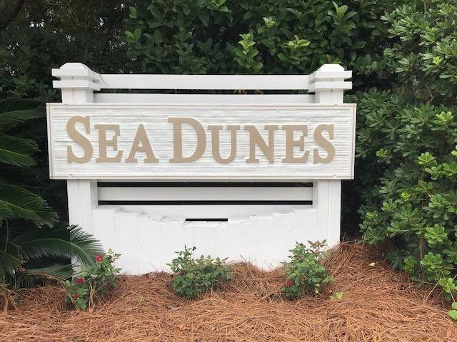 55' x 104' size lot, large enough for a pool! No Backyard Neighbors, this lot backs up to small 50' deep section of wooded common area which adds additional privacy. No short term rental neighborhood! Tap fees have been paid by previous owner. This level lot will also save on construction cost compared to other neighborhood lots. Just a short walk down the golf cart trail to the beach or Santa Rosa Golf Course/Beach club. Cobblestone walkways and white picket fences. Walk to the beach access, bike ride along 30A or golf cart to multiple local Restaurants & Bars. Located in Sea Dunes a charming Florida cottage style neighborhood just off 30A. Dream neighborhood! No build out time.