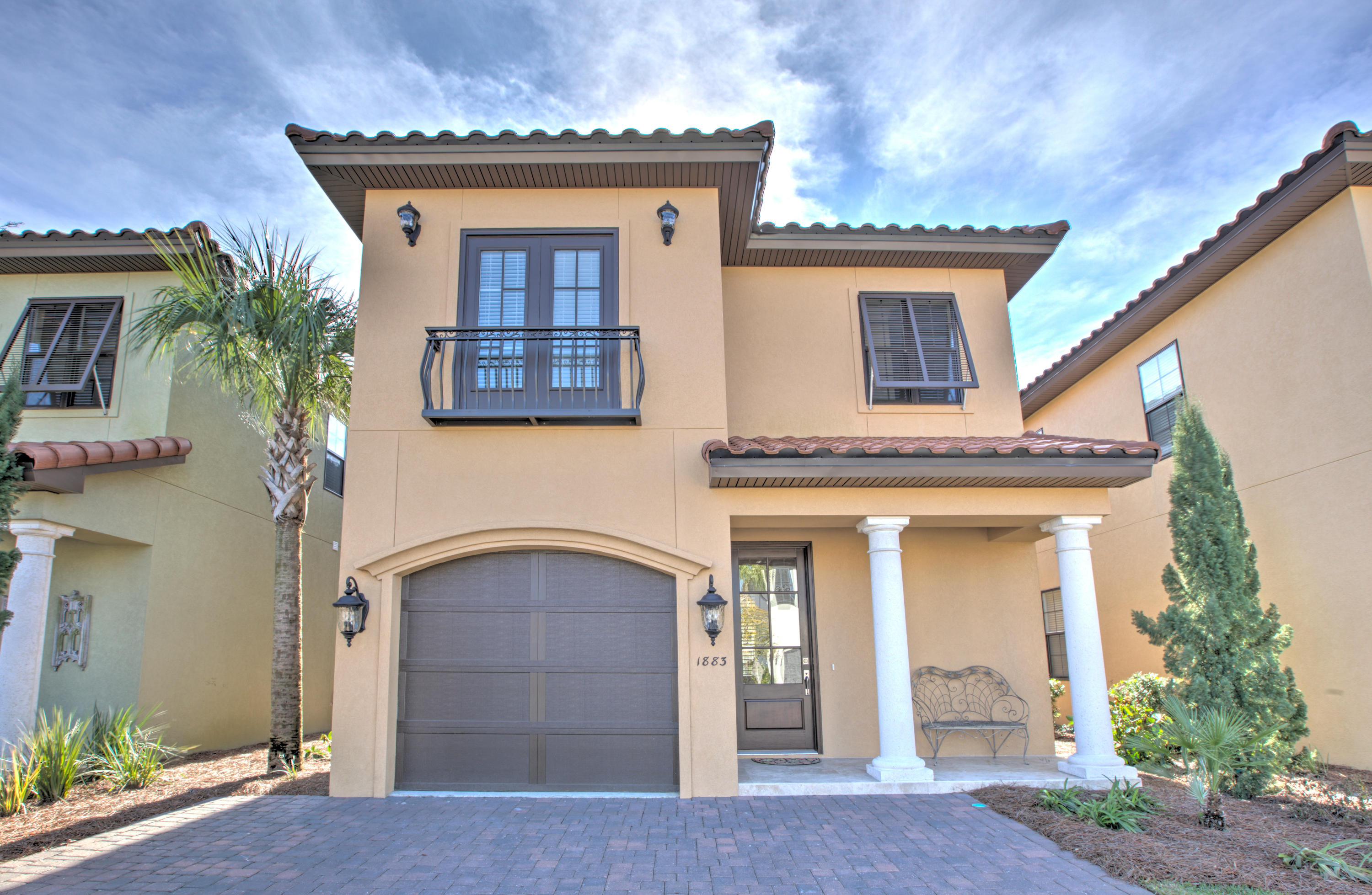 If you're looking for a pristine and well-appointed 4 bedroom home in Villa Lago with great lake and Baytowne Golf Course views, you need to see this highly desired exterior-lot stunner! From the minute you walk in, you'll notice the attention to detail from the Miami White porcelain tiled floors to the maple cabinets and marble top dining. 1883 Baytowne Loop is sold fully furnished and has an extensive list of highlights and upgrades. Just a small list include: Upgraded KitchenAide stainless steel appliances, granite countertops, two furnished patios with beautiful views, first floor bedroom, open concept living area with a 55 Smart LED TV, large master suite with large garden tub, split vanities, and large private balcony. There are upgraded lighting and window treatments througho