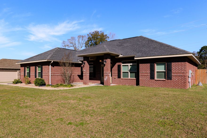 Awesome home with an in-ground pool with water feature on an over 1/2 acre lot in the sought-after gated Cottonwood community, this 4 bedroom 2 bath home boasts 10' - 12' Ceilings in the main area, 2-Car Garage, granite countertops, custom tiled shower in the primary bathroom. Additional features include: brick exterior, tile flooring in kitchen, entryways, laundry, and bathrooms. Stainless steel appliances: dishwasher, electric smooth-top cook top stove, refrigerator, and microwave. Note: This section of Cottonwood has adapted covenants that allow boat, RV, or motor home storage on selected lots. Located convenient to I-10, Avalon Blvd., Pace and Milton.