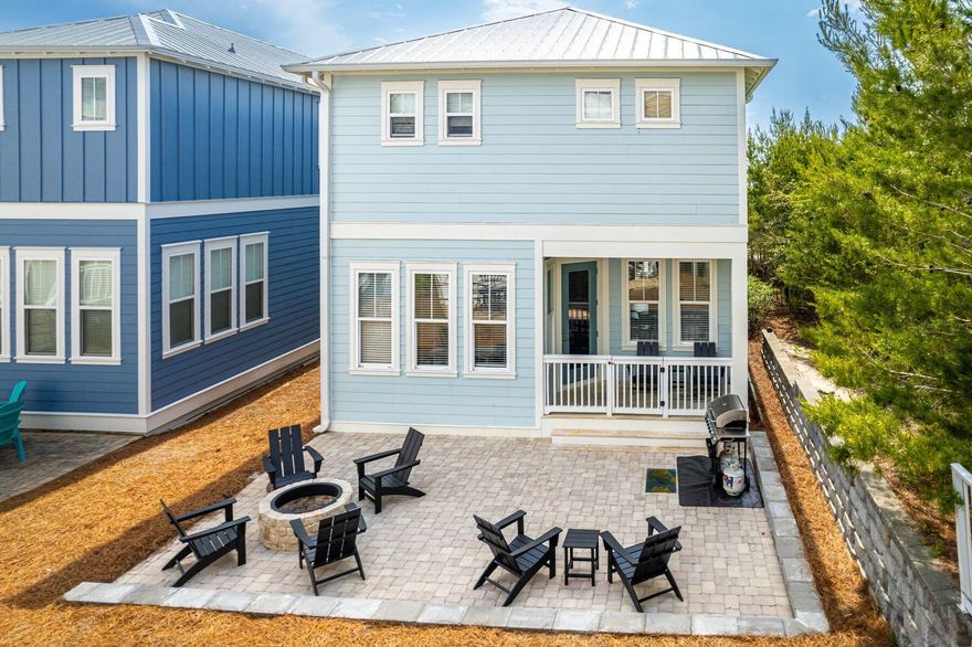 Perched over 60 feet above sea level in the heart of Blue Mountain Beach, this fully-furnished home captures the essence of Florida living. Spend your days on sugar-white sands, savoring local cuisine, or lounging poolside in the coastal breeze.A paved front drive offers guest parking, while the oversized garage accommodates a vehicle along with storage for bikes and beach toys. Inside, the open-concept great room features stylish flooring and tasteful decor. The kitchen boasts granite countertops, white cabinetry, sleek black appliances, and space to entertain with a large dining table and breakfast bar.A newly added paver patio with a built-in firepit expands the living space outdoors--ideal for evening gatherings, s'mores, or simply relaxing. With four bedrooms and four full baths, the home comfortably accommodates guests. The first floor includes a guest room with access to a full bath. Upstairs, there's another guest suite with a private bath, a bunk room with a TV for the kids, and a serene master suite with a king bed, walk-in closet, and ensuite with double vanity. A full-sized washer and dryer add everyday convenience.

Enjoy community amenities just steps away, including a resort-style community pool, outdoor kitchen, fire pit, multi-story outlook tower, and lounge seating. Walk or bike the paved path along 30A to your favorite boutiques and eateries in neighboring Blue Mountain Beach, Grayton Beach or Seaside, and try your hand at paddleboarding and kayaking on nearby coastal dune lakes.