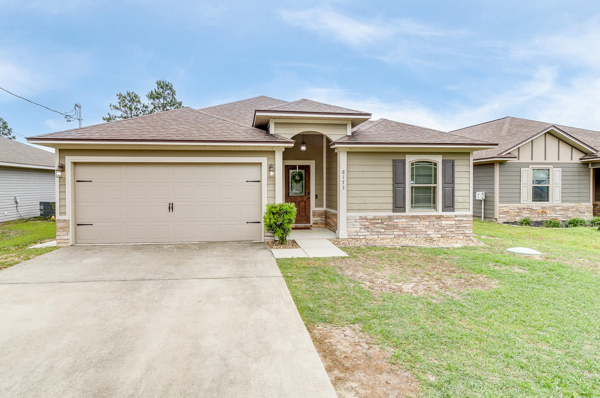 This beautiful 4 bedroom, 2 bath home is located in Navarre Florida and has NO HOA. It's spacious kitchen features, stainless steel appliances, granite countertops and a breakfast bar. The kitchen opens up to dining and living areas making the home perfect for entertaining. This split floor plan has 3 bedrooms towards the front of the home and the primary bedroom is located towards the rear. Home is situated on a great lot, with a spacious and fully fenced in backyard. You don't want to miss out on all the features this well-maintained home has to offer.