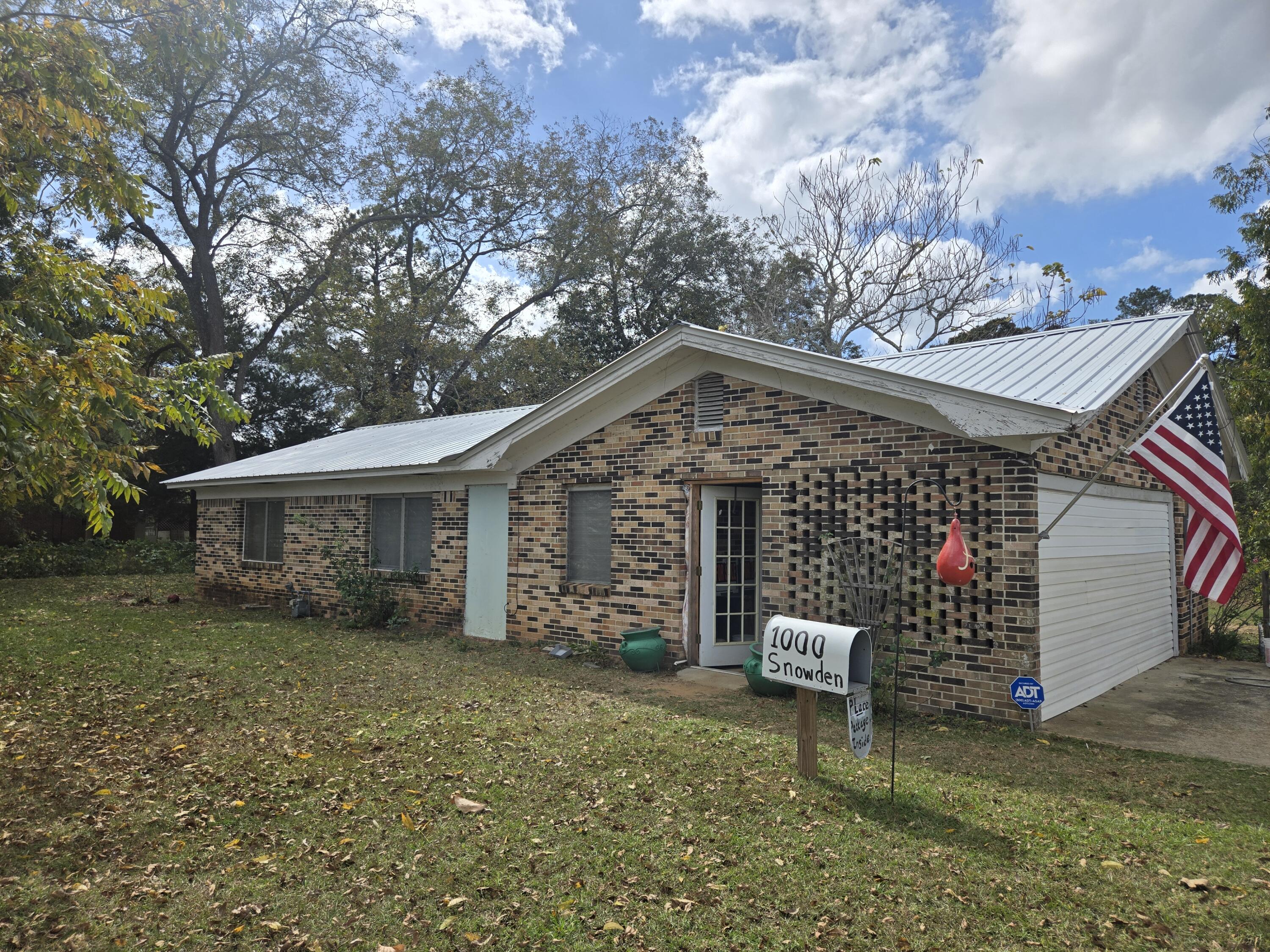 Investor special on just under half an acre. This home is ready to be finished. New roof, mini-split, plumbing, and electrical in 2023.  Insurlated in 2024. Original wood walls and floors through out. covered area on back of house that could be a covered porch or a carport. Sitting on almost half an acre, there is plenty of room for possible addition and a garage.   Buyer to verify all room dimensions.