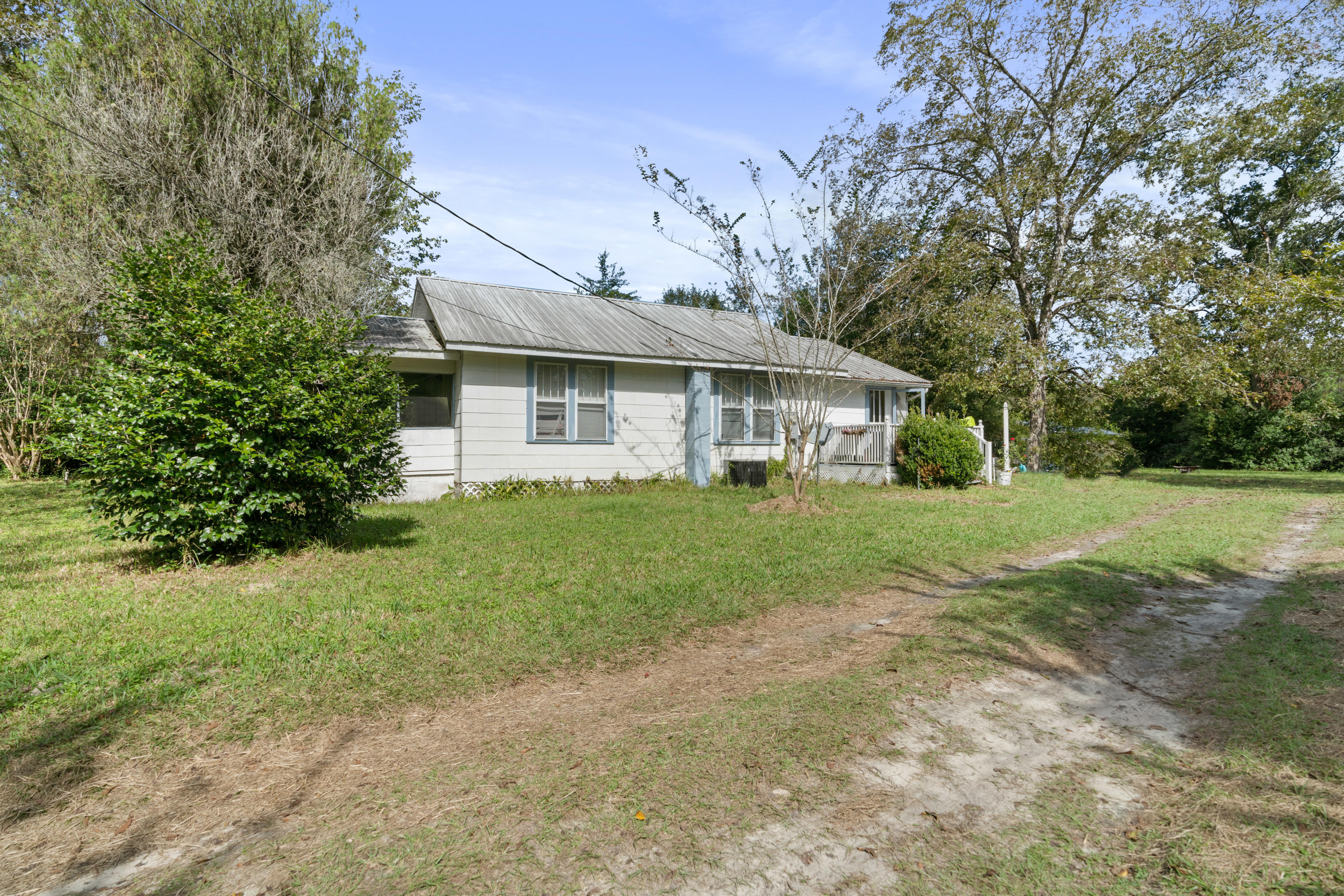 Come view this wonderful piece of property with a small fish pond and over 2.5 acres of land only minutes form the Historic downtown Defuniak Springs area. The house is being sold AS IS since it has been a rental property for multiple years with great rental income. It is the perfect place to park a motorhome or just a place that is approximately 30 minutes to South Walton beaches. There is additional property that is connected to this listing MLS #858006 that can be purchased with this listing.