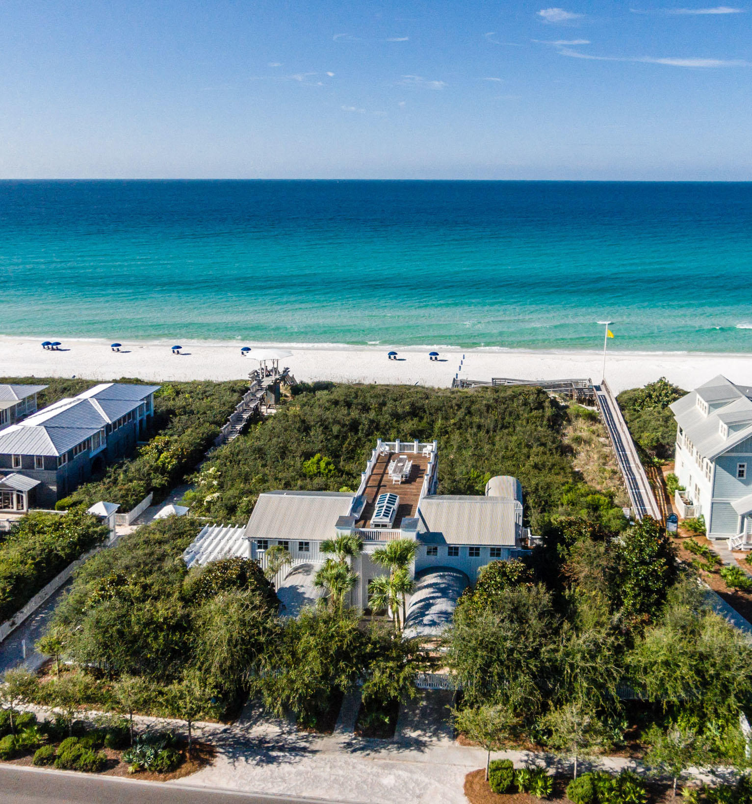 Three Gulfside lots, with a house by Pritzker Prize-winning architect, Aldo Rossi. Option to add two additional cottages, pool or private pavilion to create a large family compound on the vacant gulf front lots. This spectacular property is on Seaside's western edge, secluded but just a short stroll to downtown Seaside. The late Aldo Rossi was one of the greatest neo-rationalist architect of the late 20th century, and this is his only house in America. A pair of elegant order columns frames the entry to the house. An Oculus at the top of the entry porch gives a glimpse of the roof terrace. Rossi House was built with the best available materials, fixtures, appliances & tile work. Two guest bedrooms, each with private bath, laundry room and walk in storage closet on 1st floor. A beautifully