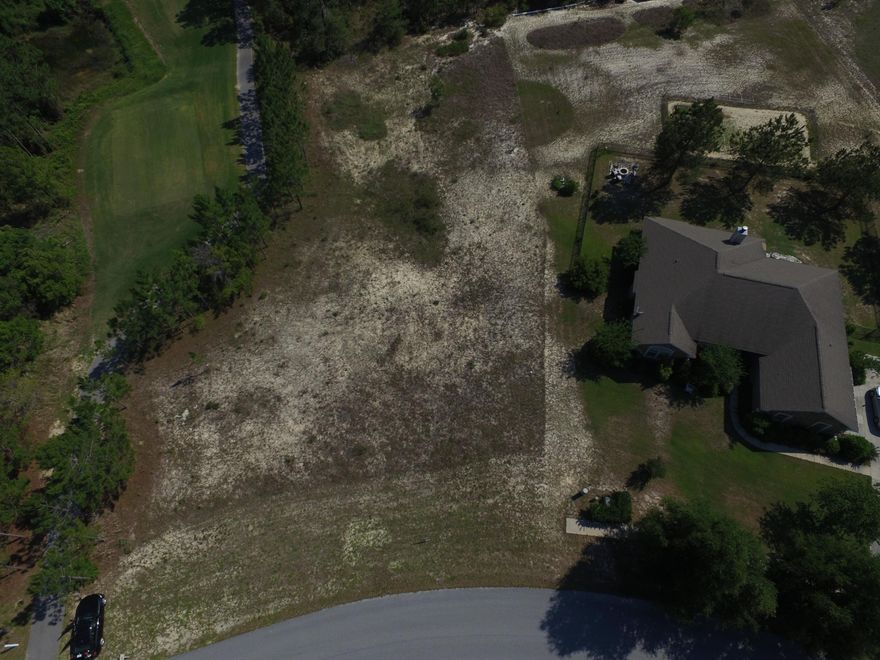 Large, affordable .82 Acre,estate size lot in beautiful, gated community of Windswept. Backing up to the subdivision's green space and to a large undeveloped parcel of land, this lot offers privacy and peaceful, natural views. Offering an deal location, the Golf course, community pool & tennis courts are just a short walk down the street. With no build out time, there's never been a better time to purchase a lot for your dream home than now.