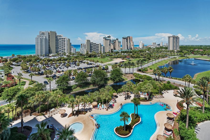 Stunning condo with a beautiful gulf view and only 300 yards from the beach! Enjoy the patio overlooking the pool area. Updated with wood grain vinyl flooring. This property is currently advertised for rentals on AirBnB.       Luau owners and guests have use of the lagoon pool featuring a grotto waterfall and tiki bar and a private pathway to the beach, fitness center, owners' storage cage, and covered garage parking.      Sandestin Golf and Beach Resort has been named the #1 resort on the Emerald Coast featuring miles of sandy white beaches and pristine bay front, four championship golf courses, world-class tennis center, 4 swimming pools, marina, fully equipped fitness center with Spa and The Village of Baytown Wharf, with events, shopping, dining, family entertainment and nightlife.