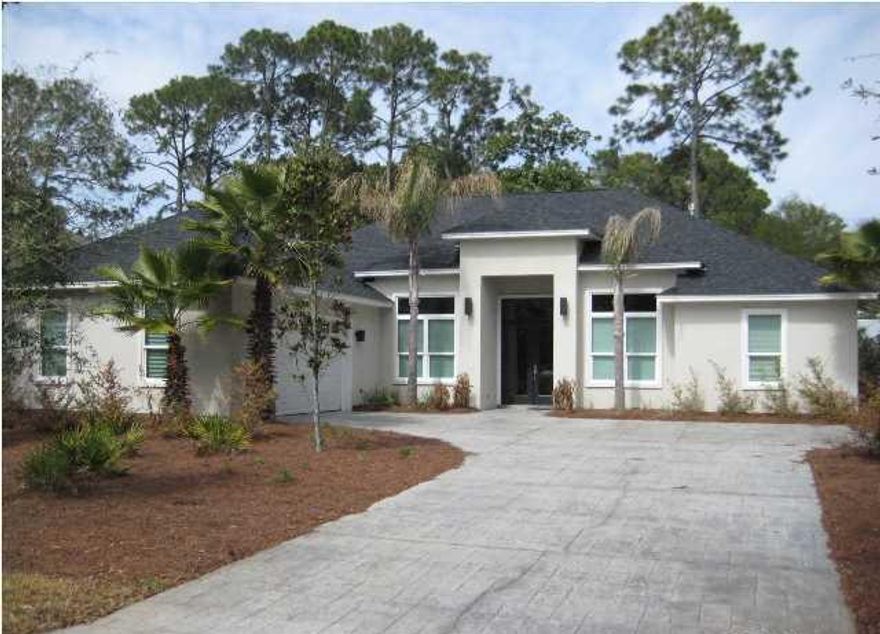 IF YOU LIKE ''MIAMI BEACH STYLE'' YOU'LL LOVE THIS HOME! Don't miss out on this rare opportunity to own A CUSTOM BUILT CONTEMPORARY STYLE HOME IN THE PRESERVE ON THE BAY! This ''like new'' home built in 2011 is a rare find and features a large open floor plan with 14' ceilings in foyer, 12' ceilings in all public areas and 10' ceilings in all bedrooms. Custom cabinets throughout, quartz counter tops, beautiful hard wood bamboo floors in entry, dining, office and living area; tile floors in kitchen, laundry, breakfast nook and baths. Kitchen features stainless appliances with glass tile backsplash, quartz counter tops and separate island/bar. Open foyer/dining area features beautiful crystal chandeliers with built in cabinets in dining area. Open living area features a 42'' gas burner