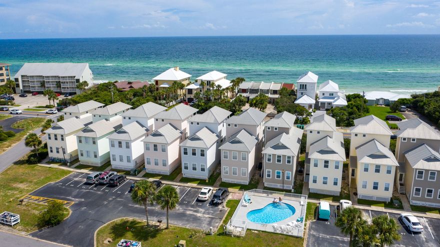 Beautiful views of the emerald green waters of the Gulf of Mexico from both 2nd and 3rd story. This is a fantastic home for the price and location - right on 30A and only 1 lot away from the beach. This home features full length balconies across the back of all three levels of the home so you can enjoy the beach right from your backdoor, 2 master suites (one on ground floor, one on the third floor) and 2 additional ample sized bedrooms to host large families or friends. This quaint community is comprised of 12 beach cottages offering a low maintenance exterior with a natural landscape buffer, community pool and incredibly easy access to the beach via wooden walkway.