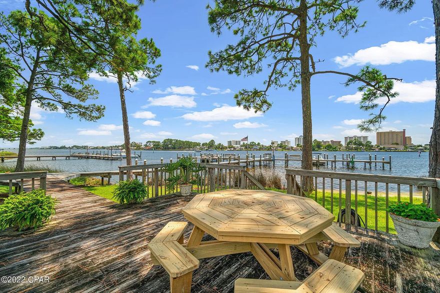 This recently renovated end unit is a MUST see in Grand Lagoon Cove! Grand Lagoon Cove is a small community conveniently located off North Lagoon, just a short distance to some of the best food in Panama City Beach. Unit 26 is a 1 bed 1 bath unit on the second level with a pool view off of the back deck. It includes new stainless steel appliances, new washer & dryer, and new bathroom appliances. Simply put, all it needs is YOU! Make this your primary, secondary or investment property.... the choice is yours! STR is allowed. Schedule your showing today.Buyer to verify all information and measurements deemed important.