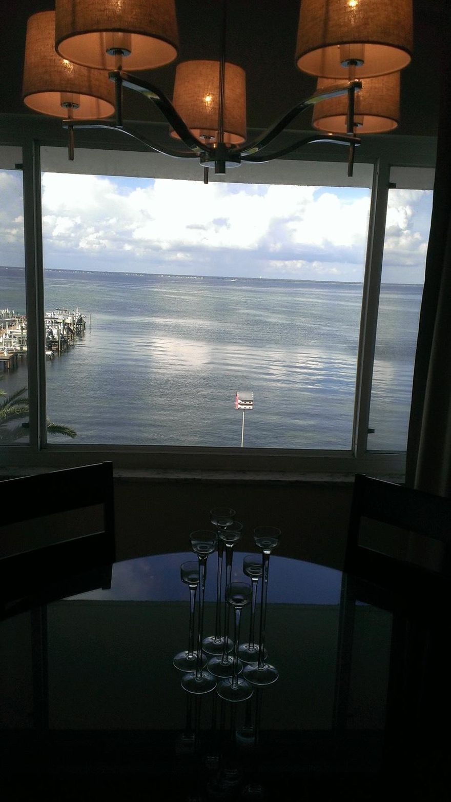 LOCATION, LOCATION, LOCATION!!! IT IS RARE that one of these beauties ever come on the market. This end unit features the most beautiful panoramic view of the bay and manicured grounds that you could find. This is a perfect home for water lovers. Sit at your dining table and just feel your blood pressure go down! This unit has new kitchen cabinets, granite, and stainless steel appliances. Both bathrooms have new vanities and there is NO POPCORN CEILINGS!! There is also nice tile and carpet, heated swimming pool and meticulously cared for grounds. There is no where in Destin that you can get these water views along with these low association fees. There is a community laundry and private storage area on each floor, along with an owners storage inside the unit.