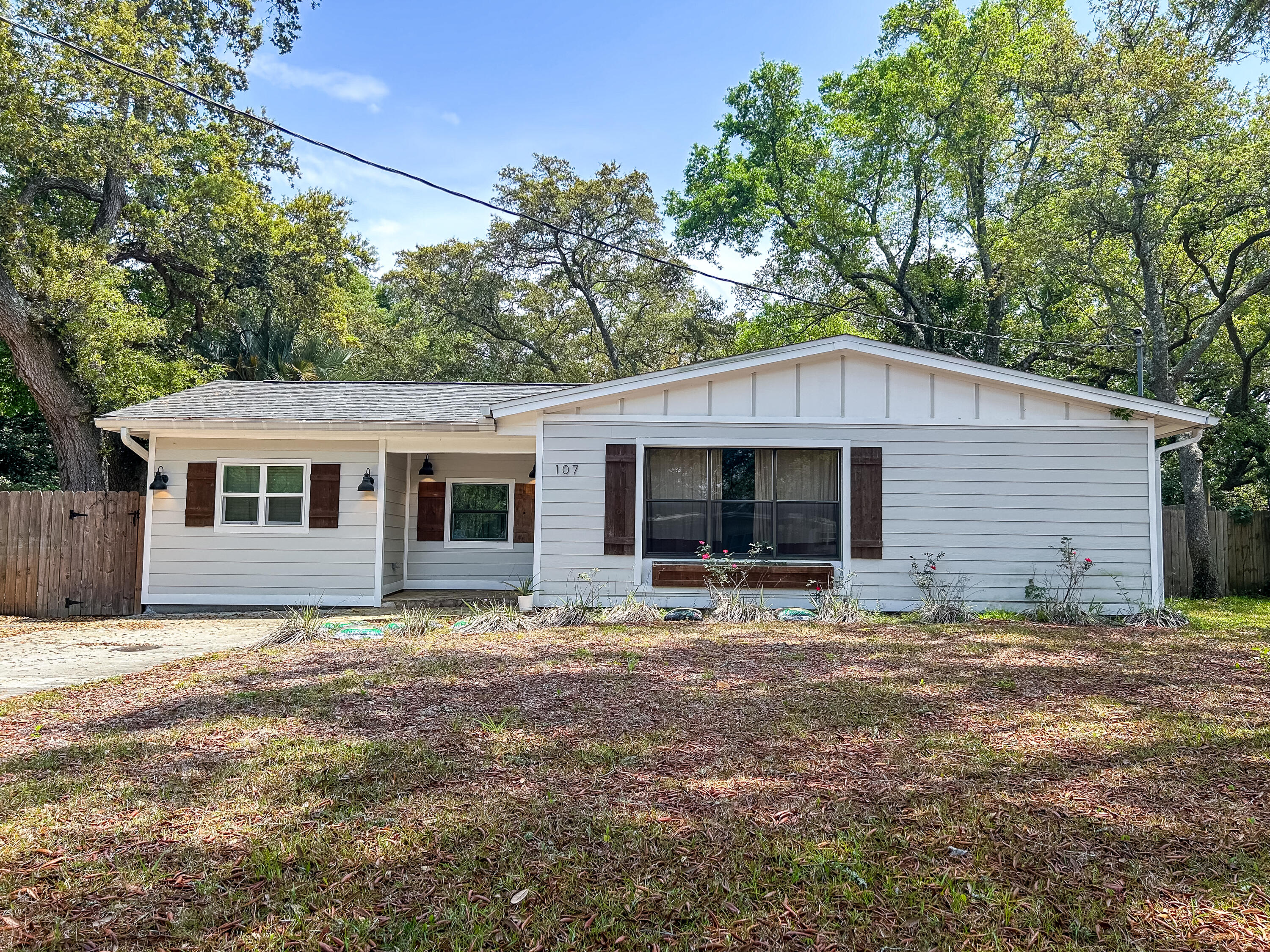 Bright, fresh, and full of charm, this home feels new but still holds onto that dreamy mid-century beach vibe. Inside you'll find durable driftwood-style flooring, a gorgeous modern kitchen with granite counters, shaker-style cabinets, stainless steel appliances, and a farmhouse sink you'll actually look forward to using.Both bathrooms are completely updated with timeless finishes.Out back you'll find a private, park-like setting perfect for relaxing or entertaining - mature trees, lush lawn, and just the right amount of shade. There's also a sturdy metal shed for storage and convenient side parking for your beach gear, bikes, and more. Enjoy unbeatable convenience with Ferry Park just across the street, quick access to boat launches, and all the shopping and dining options at Uptown Station just minutes away!