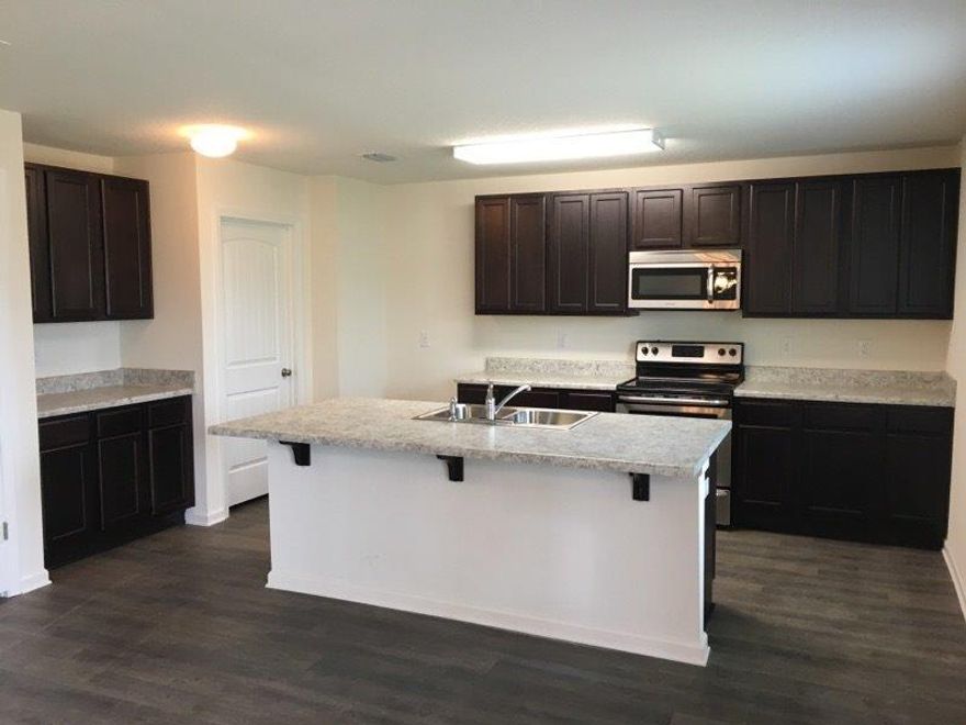 The Eaton is a 4 bedroom, 2.5 bath, 2 story home located SOUTH of I-10 on the east side of Hwy 85. Large kitchen with island, pantry, smooth top range, microwave and dishwasher. County taxes and public sewer. Listing Broker/Salesperson has ownership interest in the property. Pictures, photographs, colors, features and sizes are for illustration purposes only and will vary from the homes as built.Home and community information including pricing, included features, terms, availability and amenities are subject to change and prior sale at any time without notice or obligation. Estimated completion is April.