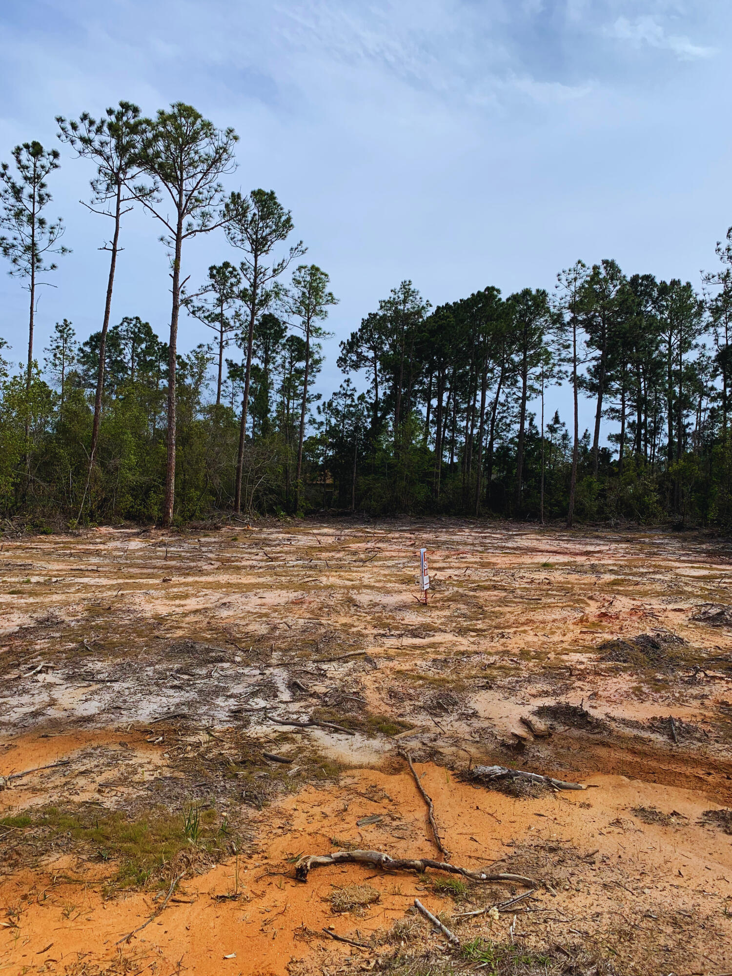 Build your dream home on this .46-acre lot at 6531 Leisure St in Holley by the Sea! Conveniently located 1 mile north of Hwy 98 x Edgewood Dr, the lot is already cleared and ready for your plans, saving you approximately $15,000 in clearing costs! Road is scheduled to be paved. Wetlands study available. Utilities are available.HOA membership includes a 48-acre Park and Recreation Center about 5 minutes away from the lot on Hwy 98 that backs up to the Sound. HOA membership also allows access to an exercise area (free weights, cardio theater, weight stations, stretch room, sauna/steam room), event room, 3 swimming pools, 8 clay tennis courts, pickle ball court, basket ball courts,  walking trail, shuffle board, grill pavilion, game room (pool, foosball, ping pong, air hockey), summer camp, and swimming lessons. Soundside Beach Area (beach, playground, fishing pier, flag golf), boat ramp & pier. Hidden Creek Club is minutes away offering 18 holes of golf on one of Florida's top courses.
Area builders are familiar with the HOA building process. Minimum square footage required is 1400 sq ft. Motivated Seller. Submit all offers.