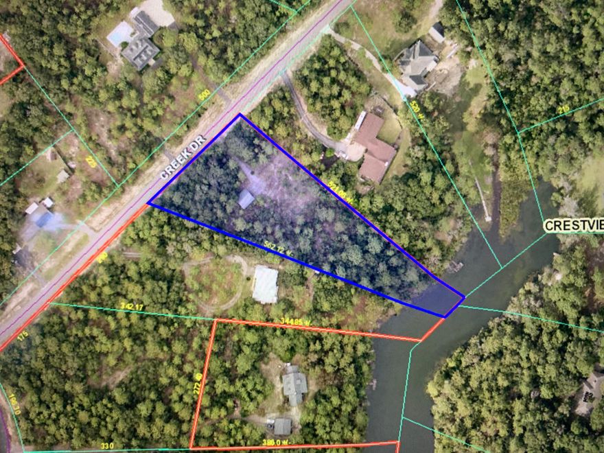 This beautiful 2.13-acre lot ready for construction, offers an incredible opportunity to build your dream home on the serene waterfront of Lake Rhonda, right in the heart of Crestview. NO HOA! *Manufactured Homes Allowed***Features:**- **Garage/Workshop:** A spacious 729 sqft, garage/workshop built in 2020, featuring finished concrete floors--ideal for all your storage or project needs.Don't miss out on this unique chance to create your perfect dream home setting!