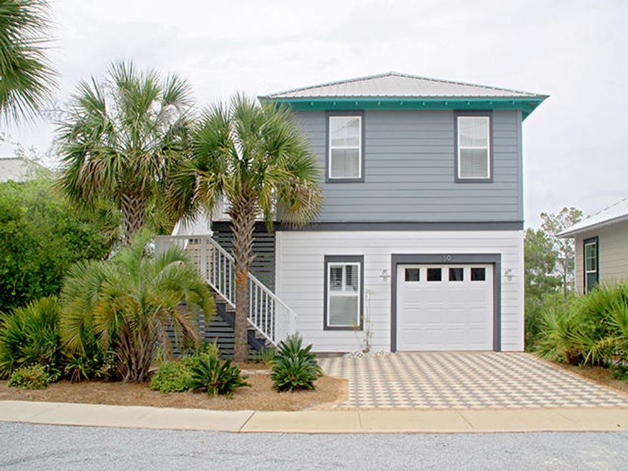 Room to grow. Beach Baby is positioned on the lot to expand for a main home. This is a rare opportunity to own in Seacrest Beach and receive rentals while building your main home. Beach Baby was a labor of love. Enter the second floor living space and you'll find yourself within airy cathedral ceilings. Your living and entertaining space becomes even more expanded with second floor wrap-around decks, surrounded by tall fanning palms and natural green space. Home is in immaculate condition.The casual galley kitchen with solid granite counter tops is fully equipped for all your cooking needs. The home has 2 bedrooms and lives way bigger than the actual sq. footage.A spiral staircase with a safety gate allows you to go directly downstairs.