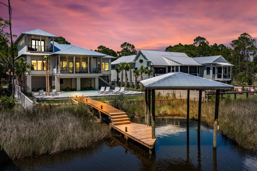 Sleek, modern architecture meets the otherworldly beauty of the Bayou in this brand-new custom home that would make for an excellent primary residence, second home or investment property. Perched at the water's edge, this boaters' paradise features a private dock that makes living on the water an everyday adventure, a refreshing pool relaxes cares away, and wide open views create the backdrop to an extraordinary life. Interiors offer striking finishes, with an open concept living room featuring wood floors, stained wood ceilings, breathtaking bayou views, and a large covered balcony with a built-in grill. The kitchen is stunning, with an oversized island that offers bar seating, and a place to gather with good company to enjoy impressive views.