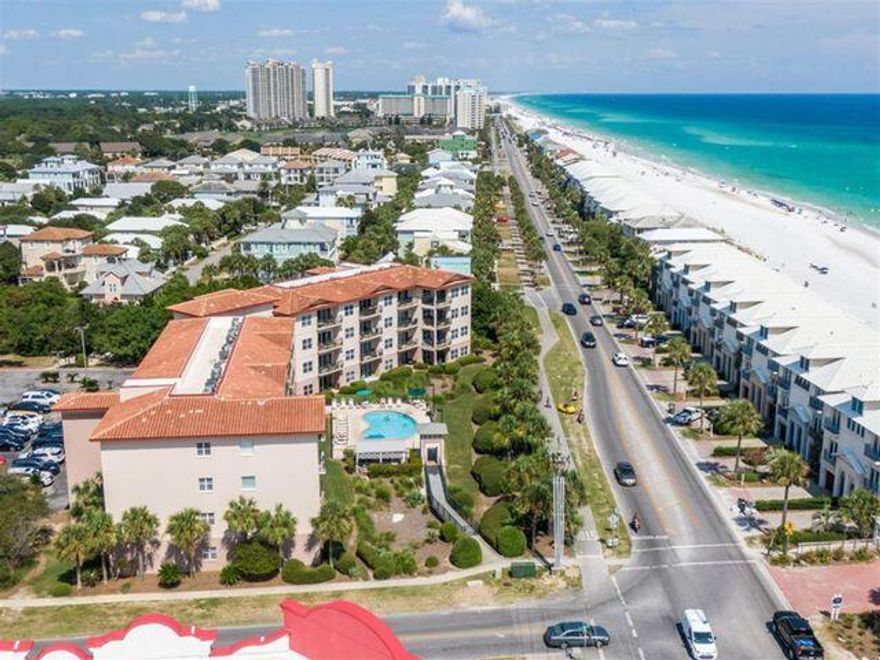 JUST 75 STEPS TO THE BEACH! Any closer, it would be BEACHFRONT! Don't miss this beautifully remodeled GROUND FLOOR unit. Walk right up to the door of this clean and fresh condo.  Enjoy the salty breeze with your family including the dog at this PET FRIENDLY complex. Your own covered porch and grassy yard with beautiful grounds to explore will keep everyone happy. Boasting fully stocked kitchen with updated appliances and full size washer and dryer. Relax in the master with ensuite bathroom. Cozy custom guest room with 2 loft style twin bunks and a king is a great use of space.  This desired location has restaurants and coffee within easy walking distance. AND to top it all off you will love the PRIVATE  beach access for Emerald Waters use ONLY. Check out the video and make your appt!