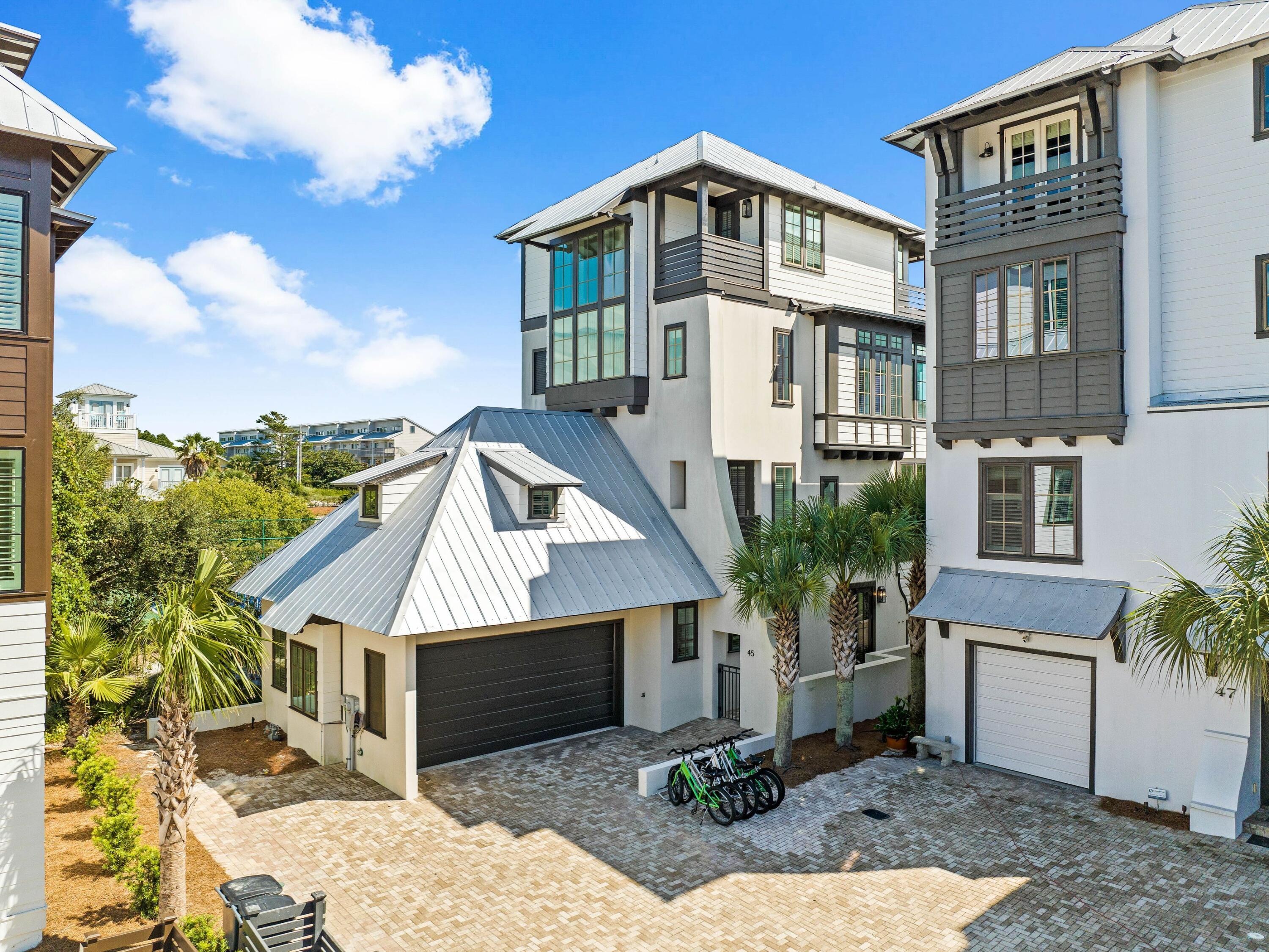 Welcome to an exceptional retreat in the exclusive Tresca Place community of Seagrove Beach, where modern luxury meets coastal charm. Located just a six-minute stroll from Walton Dunes public beach access, this stunning four-story home offers gulf views, a private pool, and access to a community pool, making it the perfect sanctuary for families or an exceptional rental investment. This meticulously maintained residence boasts 3,874 square feet of thoughtfully designed living space, featuring five bedrooms and a bunkroom to accommodate large gatherings. The home's architectural elegance is highlighted by crisp white oak flooring, clean lines and timeless decor reminiscent of a luxury hotel. The first floor includes a serene queen bedroom with an ensuite bath, direct access to the private pool and a cozy family room. The second floor houses two king bedrooms with balcony access, a playful bunkroom for younger guests, and spa-like bathrooms with refined finishes. On the third floor, an open-concept living, dining, and gourmet kitchen area with marble counters and a waterfall island serves as the heart of the home. Expansive south-facing balconies on multiple levels provide breathtaking views and ample space for entertaining. The fourth-floor master suite is a private oasis, complete with a wet bar, private balcony and an Italian marble-clad ensuite. With proximity to 30A's finest dining, boutique shopping and outdoor activities, this home is perfect for those seeking an upscale beach lifestyle or a high-performing rental property.