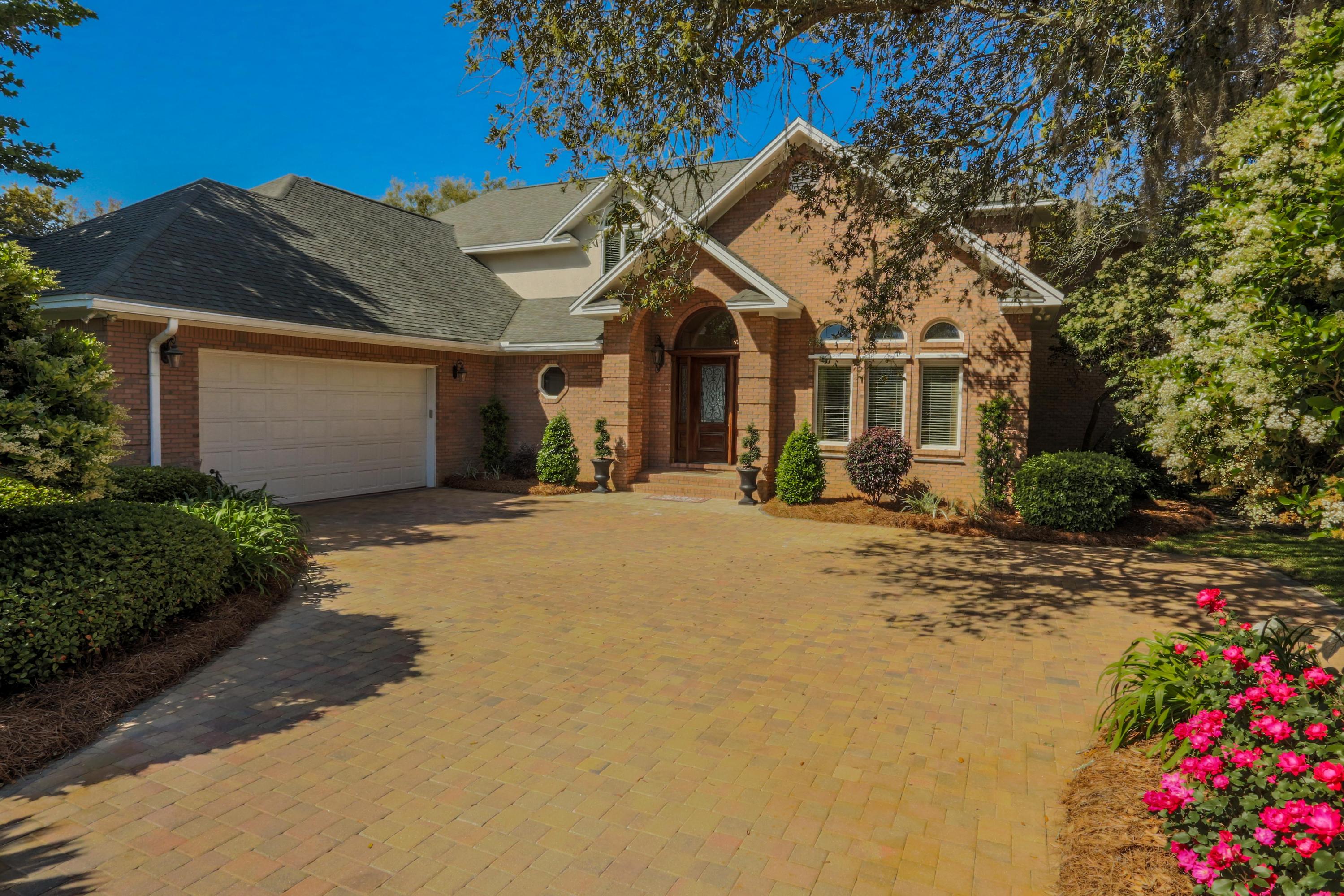This beautiful, solidly constructed residence on Garnier Bayou in Shalimar offers you a fabulous waterfront lifestyle! The 0.55 acre lot enjoys a gorgeous setting surrounded by mature landscaping in a quiet neighborhood, along with 95 waterfront feet, a large dock, 12,000 lb. boat lift, great views, and even your own small sandy beach! Inside, the home's desirable floorplan and quality finishes provide both comfort and elegance.The vaulted foyer leads to the office, which could also be a front parlor/formal living area, and the adjoining dining room, both with cherry wood floors. The huge kitchen is open to the large sunken family room, which enjoys easy access to the covered patio and backyard oasis - perfect for entertaining inside or out...