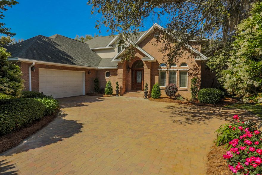 This beautiful, solidly constructed residence on Garnier Bayou in Shalimar offers you a fabulous waterfront lifestyle! The 0.55 acre lot enjoys a gorgeous setting surrounded by mature landscaping in a quiet neighborhood, along with 95 waterfront feet, a large dock, 12,000 lb. boat lift, great views, and even your own small sandy beach! Inside, the home's desirable floorplan and quality finishes provide both comfort and elegance.The vaulted foyer leads to the office, which could also be a front parlor/formal living area, and the adjoining dining room, both with cherry wood floors. The huge kitchen is open to the large sunken family room, which enjoys easy access to the covered patio and backyard oasis - perfect for entertaining inside or out...