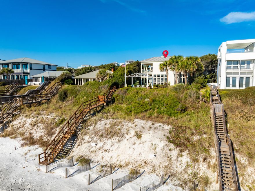 Sheltered beneath the iconic oak canopy of Old Seagrove, this architectural masterpiece captures the timeless beauty of 30A's Gulf Coast. Perched atop a 32-foot bluff with 60 feet of Gulf frontage, this 4-bedroom, 4.5-bath coastal estate spans 4031 square feet of exquisitely designed living space by Thurber Architects and recently reimagined by a renowned local designer. Every detail--new designer furnishings, custom window treatments, refreshed paint palette, upgraded A/V systems, lush new landscaping, and more--reflects a refined coastal aesthetic perfectly aligned with 30A's most exclusive lifestyle.From the moment you arrive, every element speaks to sophisticated beachfront living: a private boardwalk to the sugar-white sands, heated Gulf-front pool,glass-walled loggia, and Gulf-front pavilion offering uninterrupted views of the turquoise the Gulf. Inside, a floating European white oak staircase illuminated by an Modern Chandelier introduces a stunning balance of artistry and architecture.
The main living area unfolds with floor-to-ceiling windows, a gas fireplace, and seamless indoor-outdoor connection to the loggia and pool. The chef's kitchen features professional-grade Wolf, Sub-Zero, Bosch, and Miele appliances, dual dishwashers, wine cooler, induction cooktop, and double ovenscrafted for both culinary mastery and entertaining. A first-floor master suite overlooks the Gulf, offering dual closets and a spa-inspired bath with radiant heated marble floors and a walk-in shower.
Upstairs, two guest suites each include private bathsone transformed into a bunk roomwhile the Gulf-front primary retreat offers a morning bar, second laundry, private balcony, custom closet, and spa bath with Italian marble and heated floors.
The residence is equipped with Lutron and Control4 home automation, 12-foot ceilings, custom drapery and electronic shades, and solid concrete construction secured by a sea wall.
Ideally situated just moments from Seaside and the heart of Scenic 30A, this Old Seagrove Gulf-front estate represents the pinnacle of modern coastal luxurya rare opportunity to own a fully updated, designer-furnished Gulf-front sanctuary where timeless craftsmanship meets effortless elegance.
