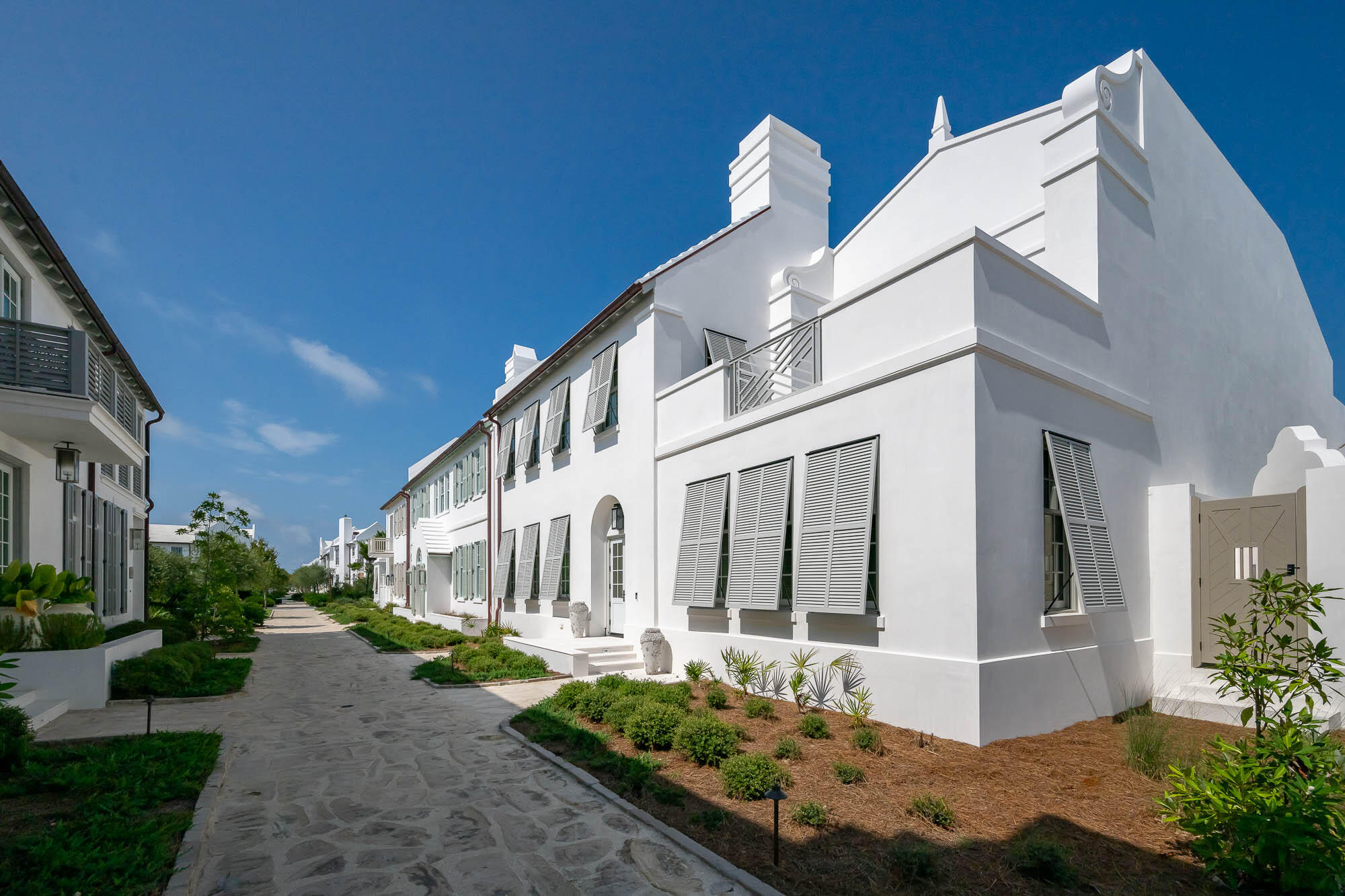 24 Smugglers Alley is a newly completed Alys Beach courtyard home built by Alys Beach Construction and designed by renowned Pledger Architect. This 4 bedroom plus bunk home fronts Turtle Bale Pedestrian Path which leads directly to the Turtle Bale Beach Access and Gulf of Mexico. The tasteful professionally designed interior furnishings set the tone upon entering the main foyer. An open layout floorplan offers a great flow into the living/dining/kitchen area with beautiful coffered ceilings and venetian plastered walls. The first floor also includes a large guest suite, laundry room, covered outdoor living area with summer kitchen, pool and lounge area. Two single car garages balance the alley entry of the home. On the second floor, the northern wing of the house is dedicated entirely to