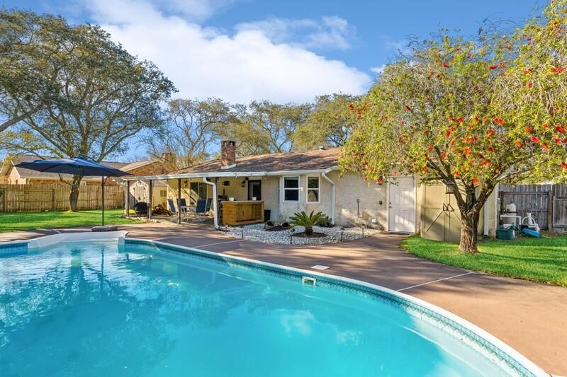 POOL HOME will be a splash! Summer is coming and you will want to enjoy every minute of it in this great fenced backyard with inviting entertainment space that includes a covered and tiled patio area with bar and a gazebo that overlooks the pool.  Grills will be left ''as is''. The Mediterranean-style home has an easy-living floor plan with a cool sunken living room, a separate dining area, and a kitchen/breakfast area with a view of the backyard.