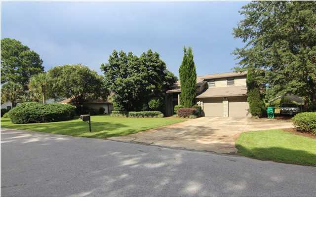 One of the BEST home sites in Bluewater Bay! Located on the Lake Course Fairway (no golf balls are ever found in the yard) with excellent views of the lake from almost every room in the house. 4 bedrooms (2 master suites), 3.5 bathrooms, 2 living areas, oversized 2 car garage with an attached golf cart shed. Large Lanai in back and plenty of room for a pool . Completely gutted & renovated 10 years ago in a contemporary style, (square footage is 3000' - as per post-renovation appraisal) with new hardiplank siding, roof, windows, AC, re-plumbed, renai gas water heating system, re-wired with quad shielded cable, audio and Cat-5 wire. All interior walls sound insulated. Bamboo, Cork & tile flooring with carpet in the bedrooms. Granite & stainless in the kitchen & master bath. Custom stair